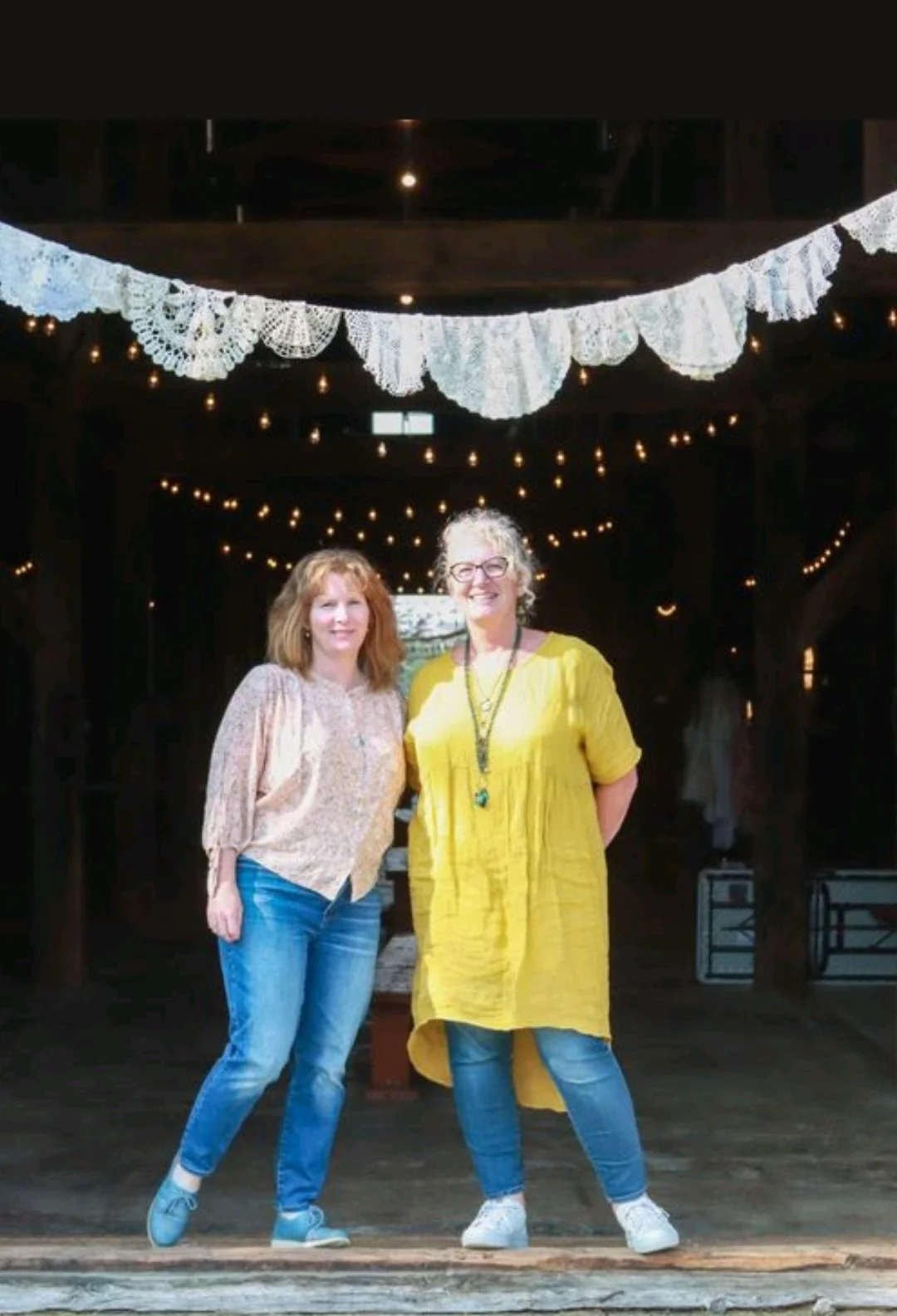 Kandace and Celeste posing for a picture outside a barn
