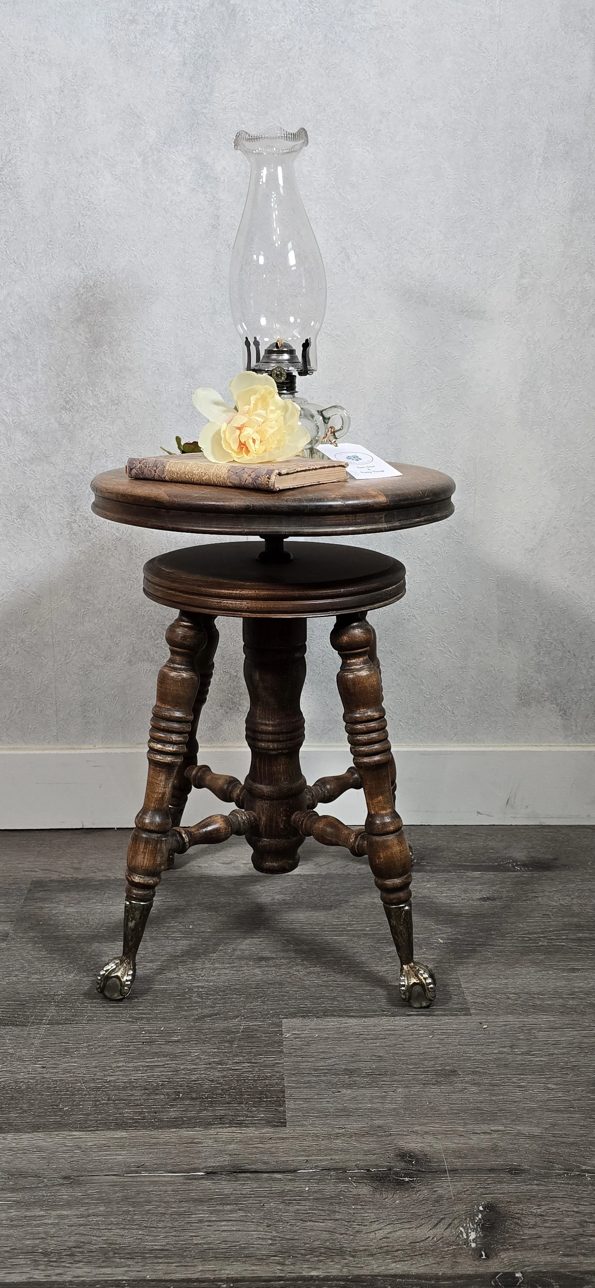 Beautiful antique piano stool with pewter clawfeet with crystal ball.  $185