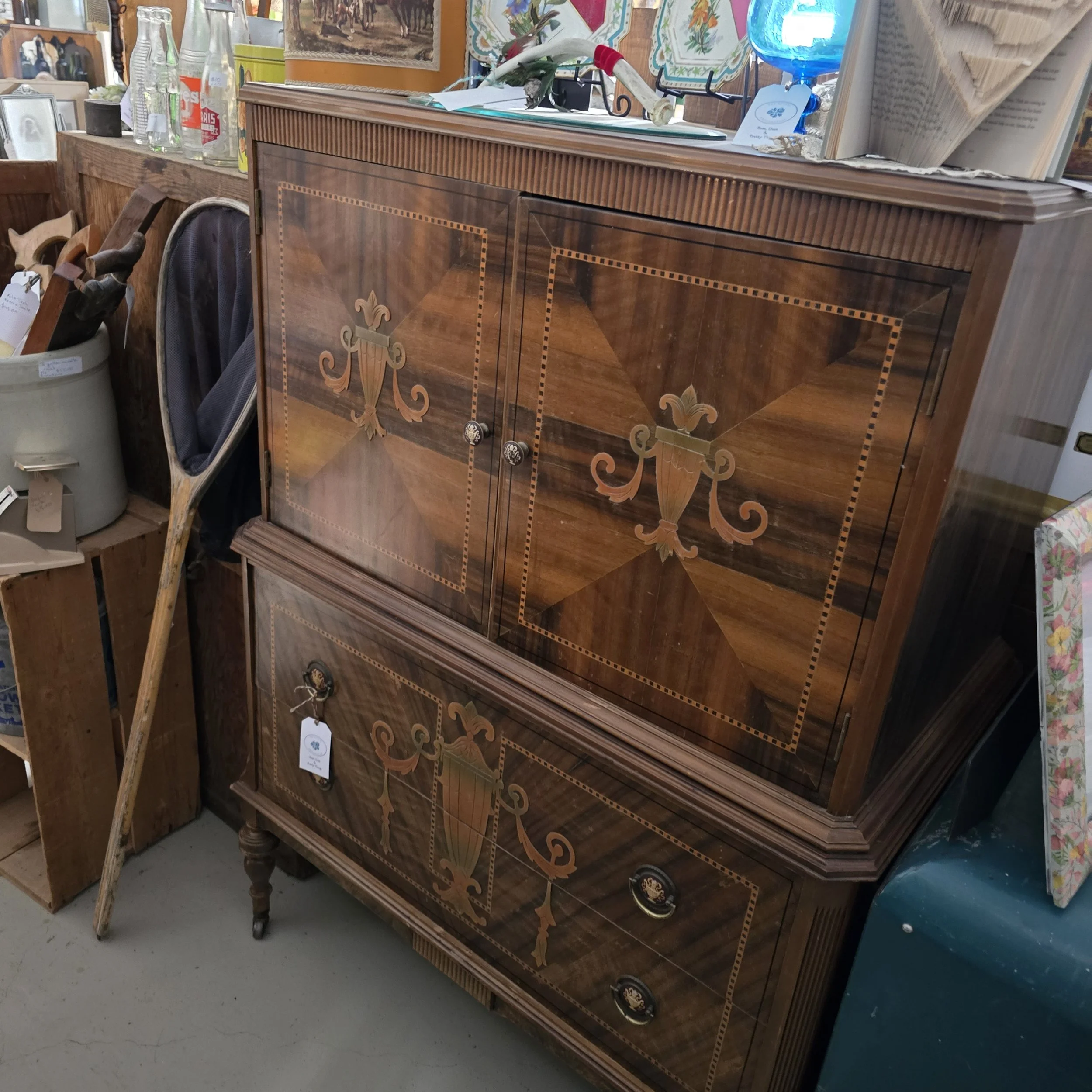Art deco highboy dresser, top has 3 drawers, bottom has 2.  Does not come apart.  in good shape.  $165