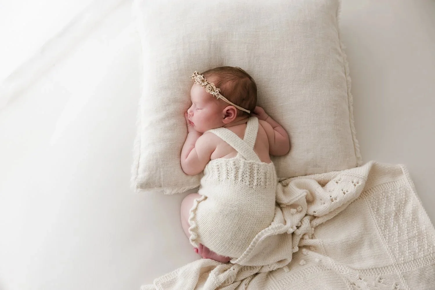 baby girl on a beanbag in a natural light studio