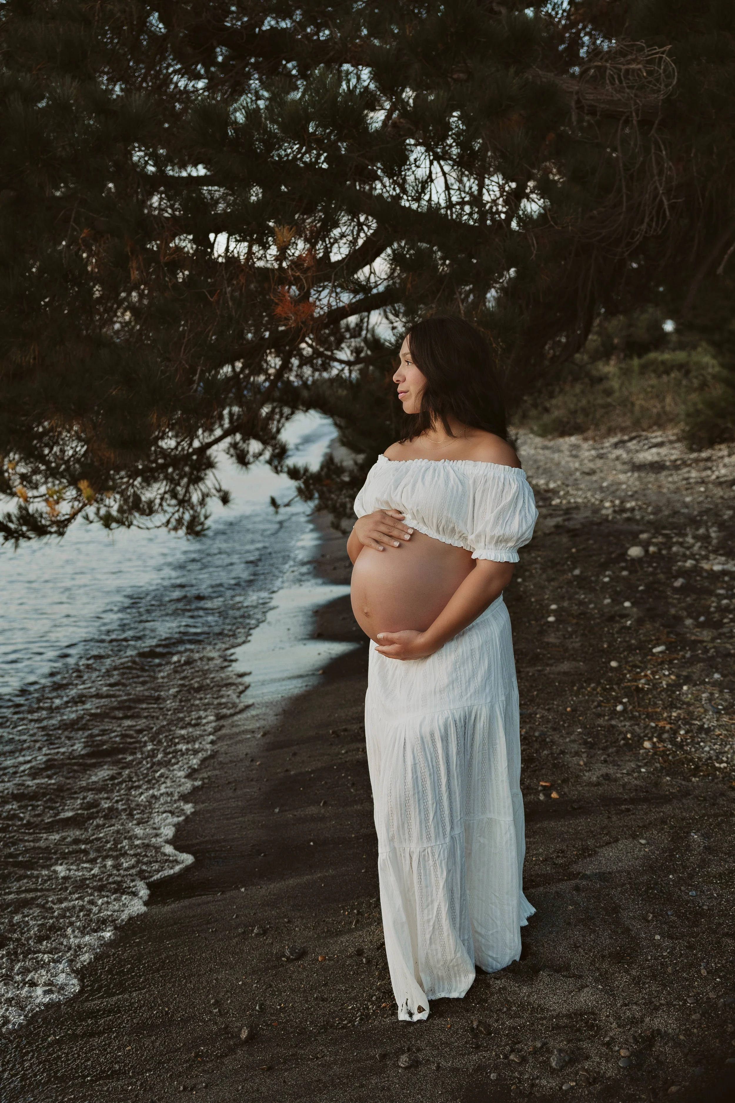 Expectant mother on lake shores