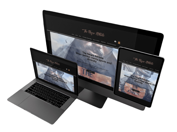 Multiple electronic devices displaying the same website: a laptop, a tablet, and a desktop monitor, with the site titled 'The Negro Athlete'.