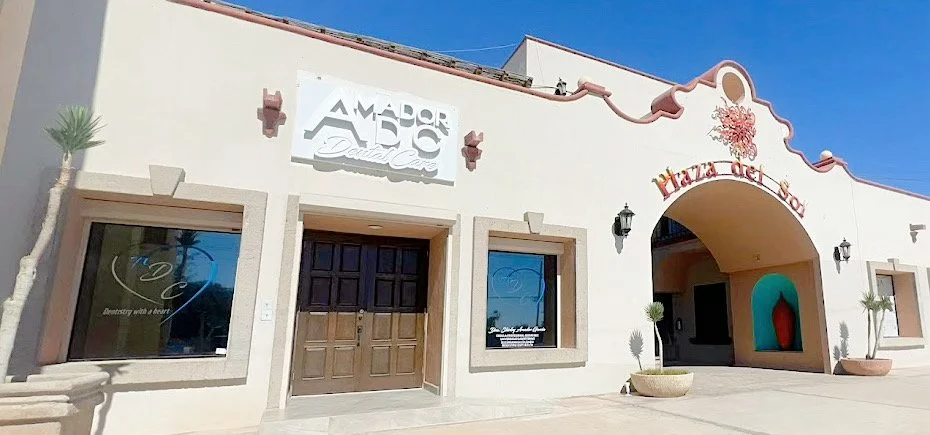 Exterior view of Amador ABC Dental Care in Plaza del Sol, featuring an arched entrance and storefront windows.