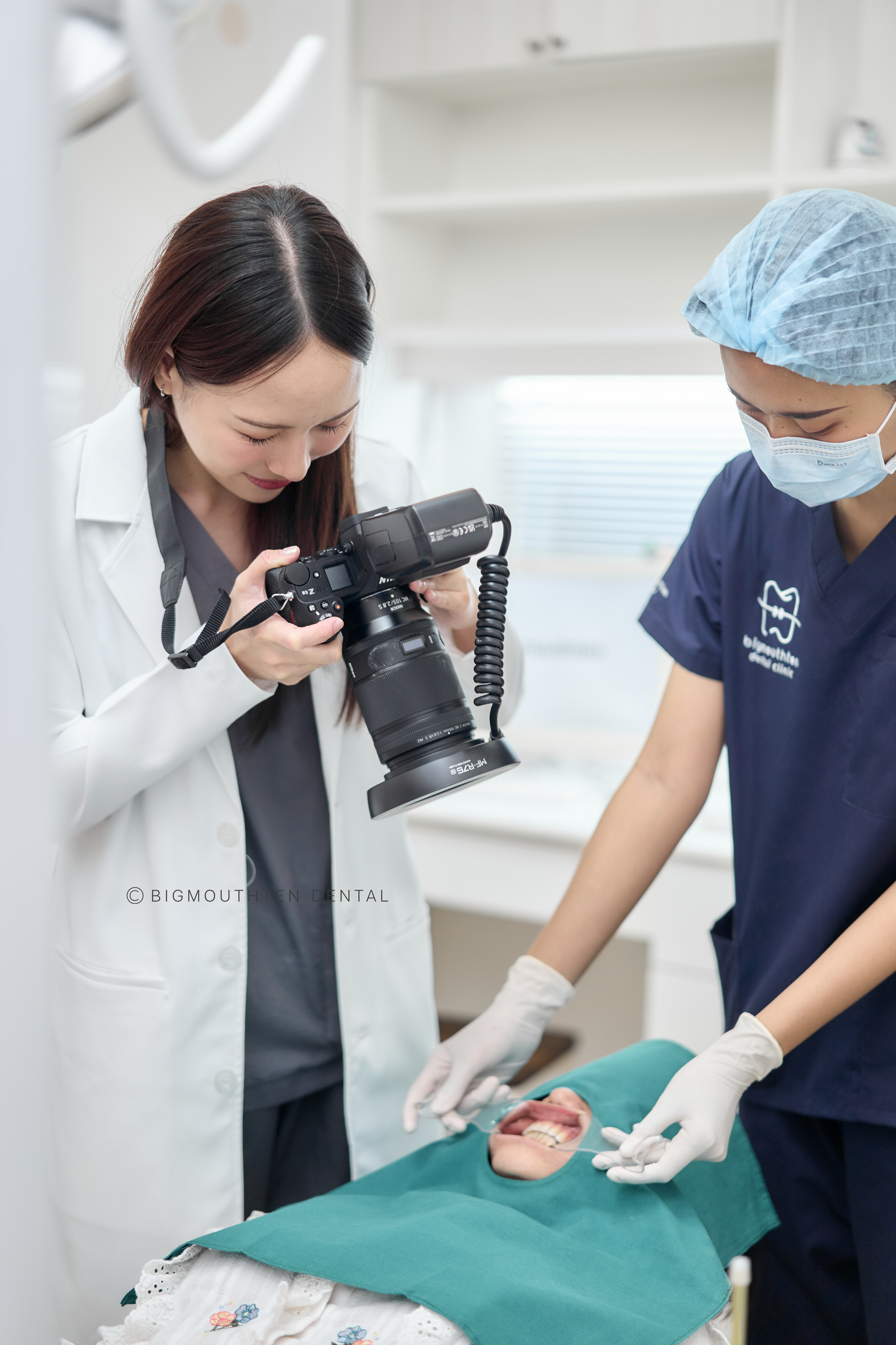 Expert dental specialists in Chiang Mai collaborating on a personalized treatment plan at Bigmouthten Dental Clinic