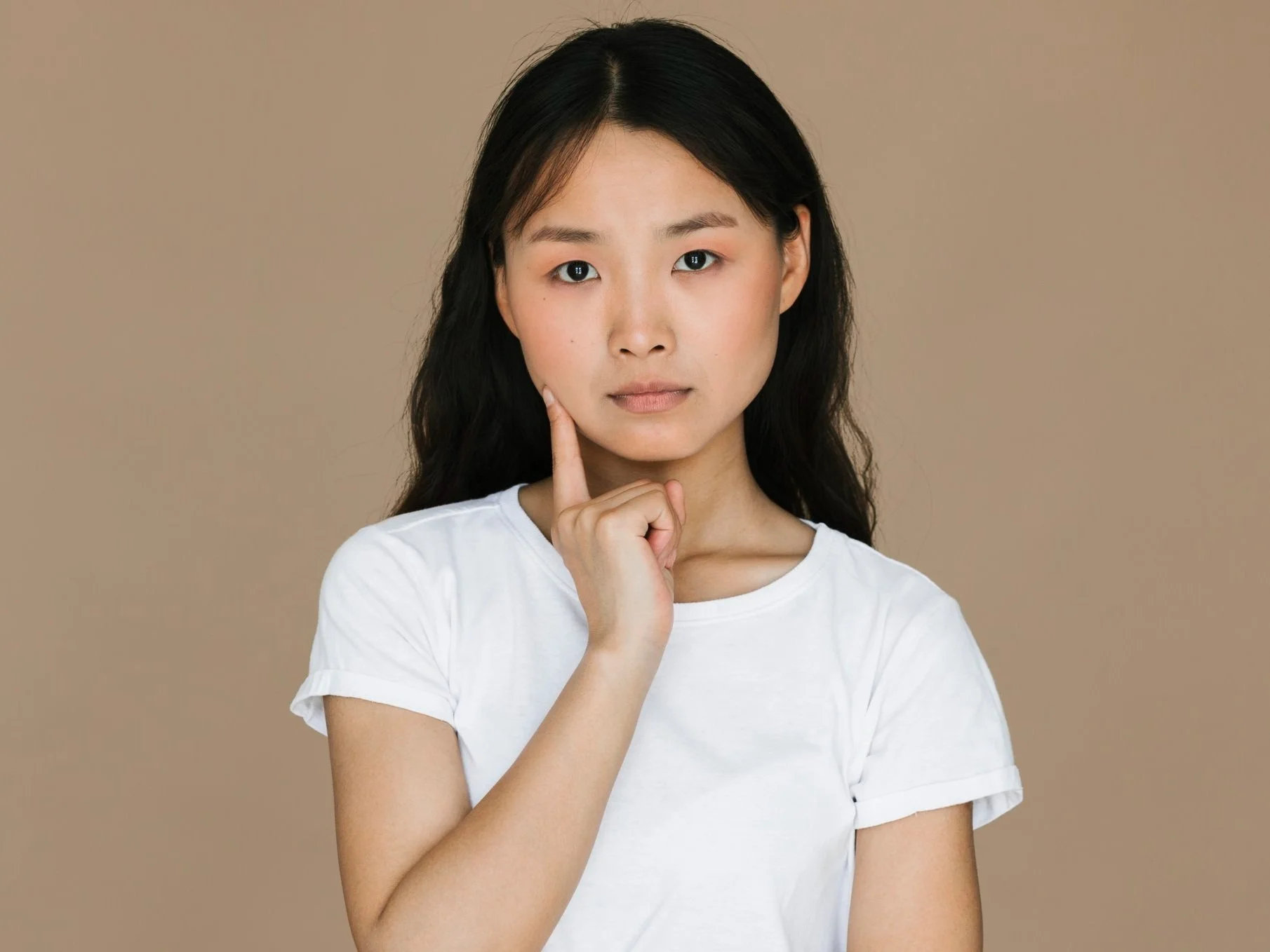 Woman thinking about braces and orthognathic jaw surgery in Chiang Mai dental clinic