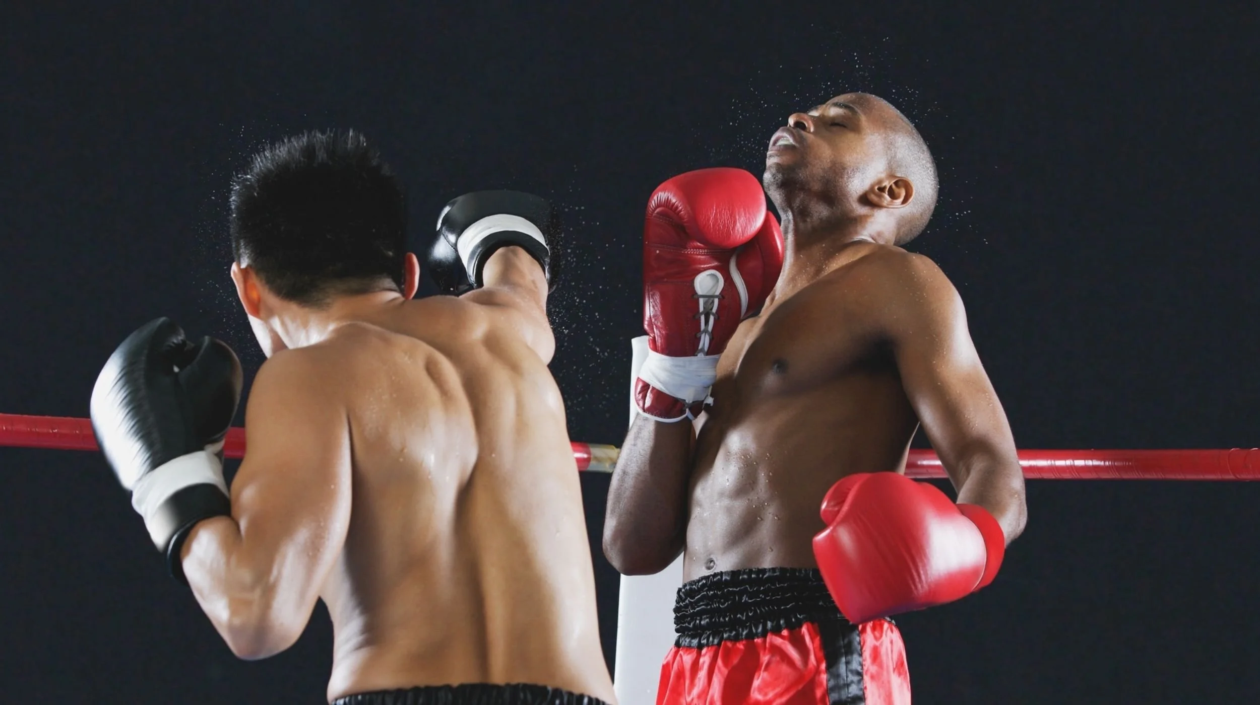 Muay Thai fighter protecting jaw with mouthguard to prevent TMJ injuries at a dental clinic in Chiang Mai.