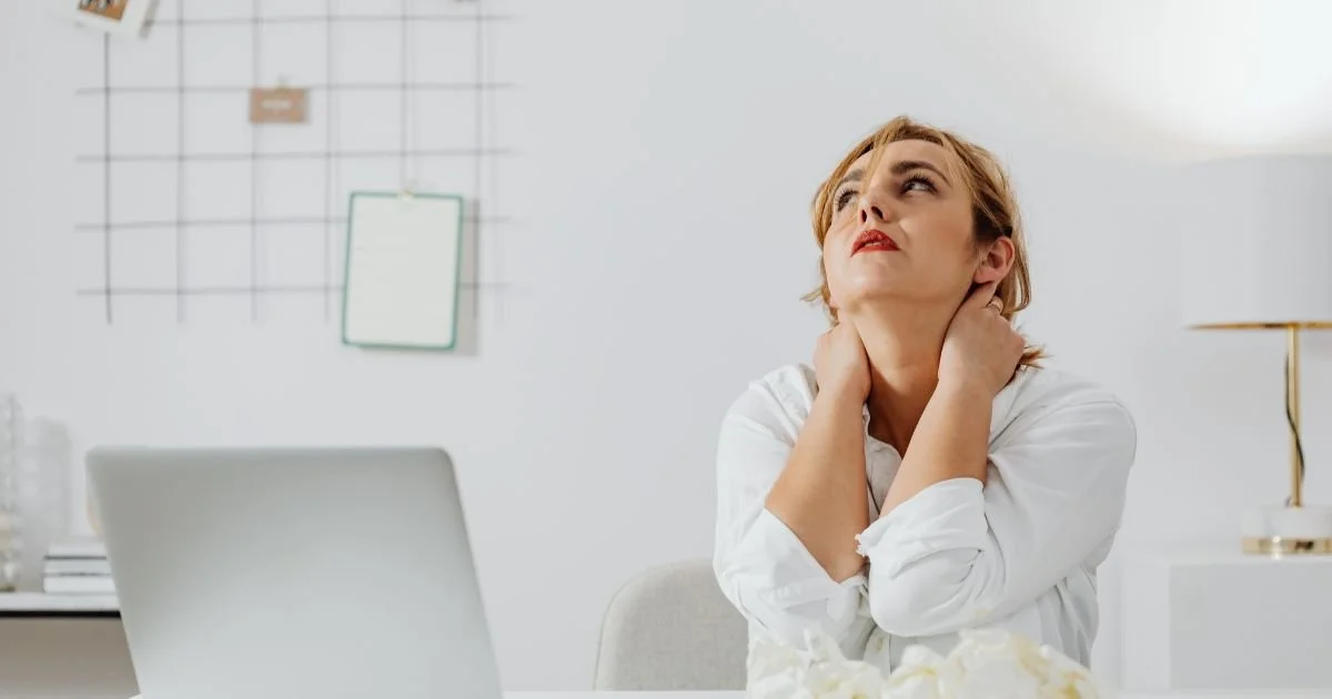 A stressed out woman at a computer.