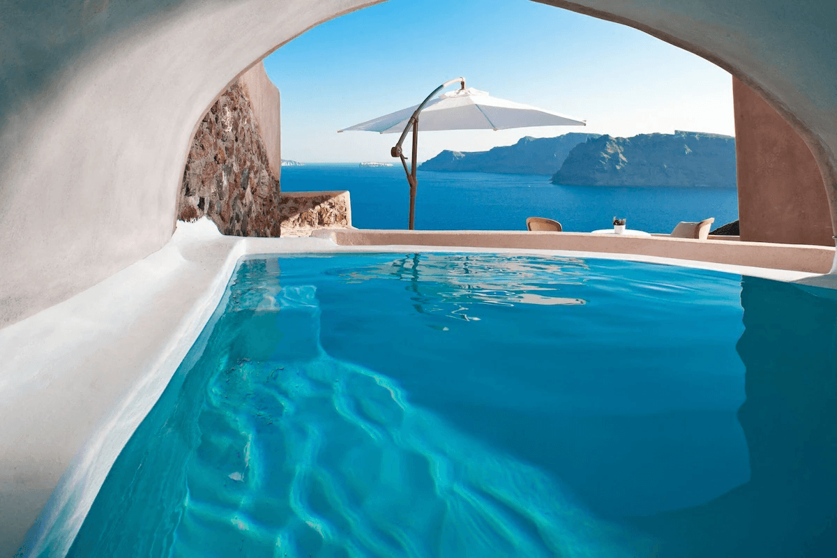 Private cave pool with panoramic caldera views at Caldera Aurelia Villa in Oia, Santorini