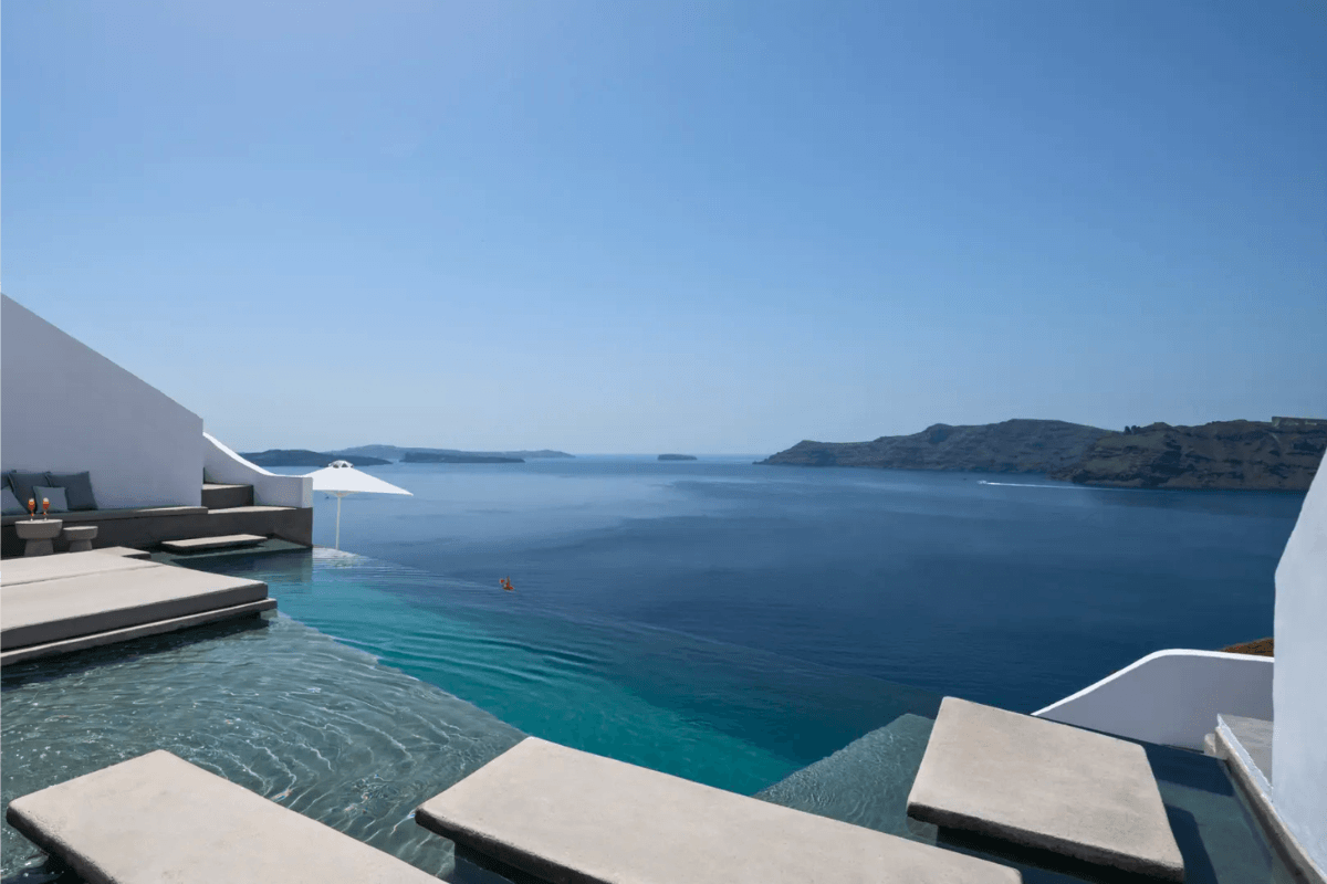 Grand Suite at Echoes Luxury Suites Oia with a private infinity pool and caldera views over the Aegean