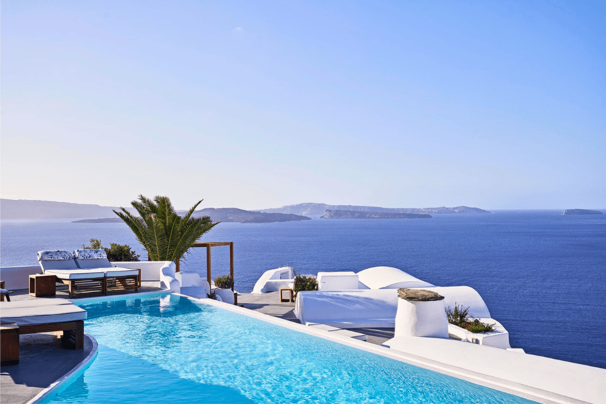 Katikies Santorini in Oia with a cliffside terrace pool and caldera views across the Aegean