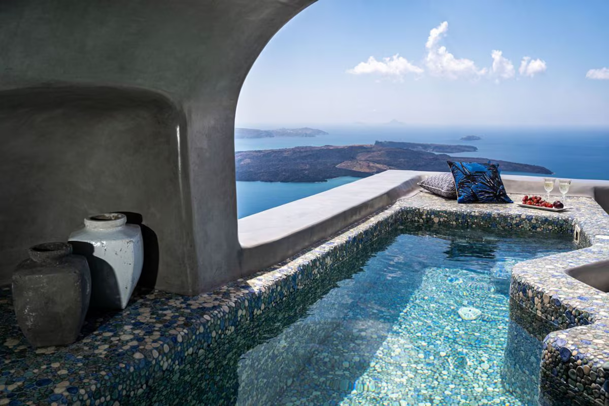 Heated plunge pool with panoramic caldera views at Luxury Cave Villa in Imerovigli, Santorini