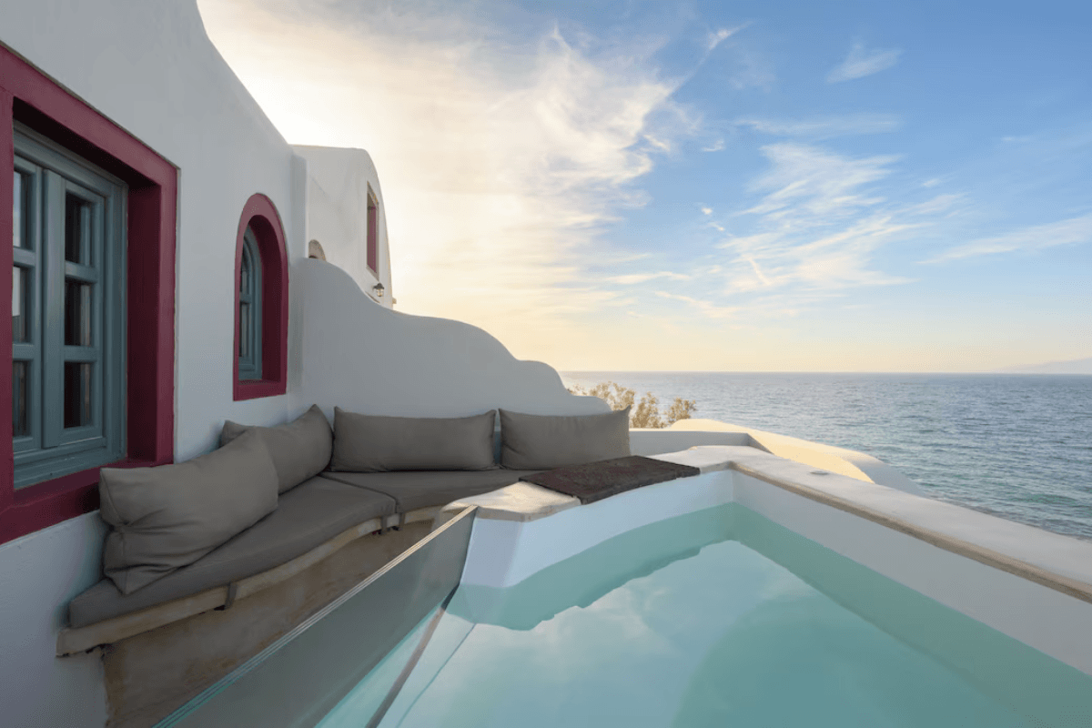 Private outdoor jacuzzi with panoramic sea views at Michelangelo Beach Villa near Oia, Santorini