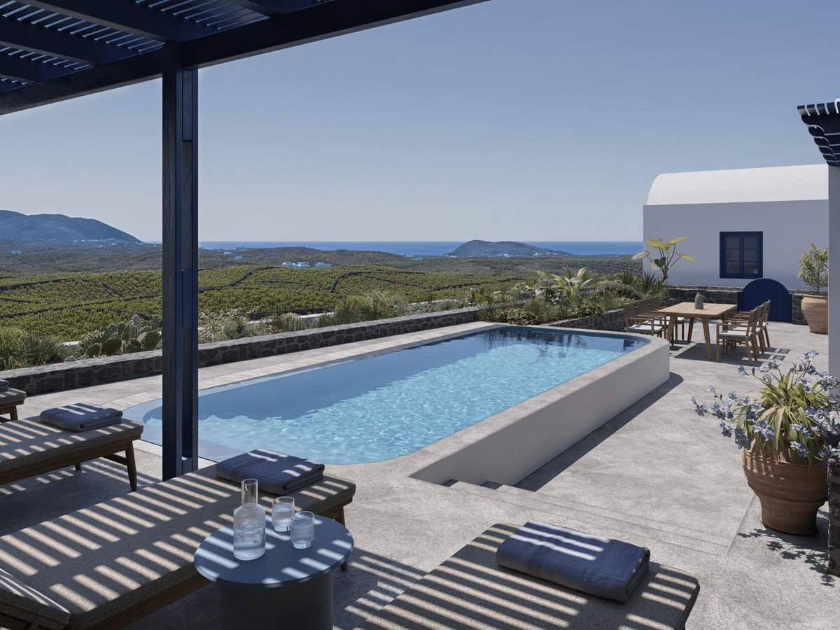 Private villa pool at Vedema Resort, Santorini 2026, overlooking lush vineyards with panoramic views to the Aegean Sea.