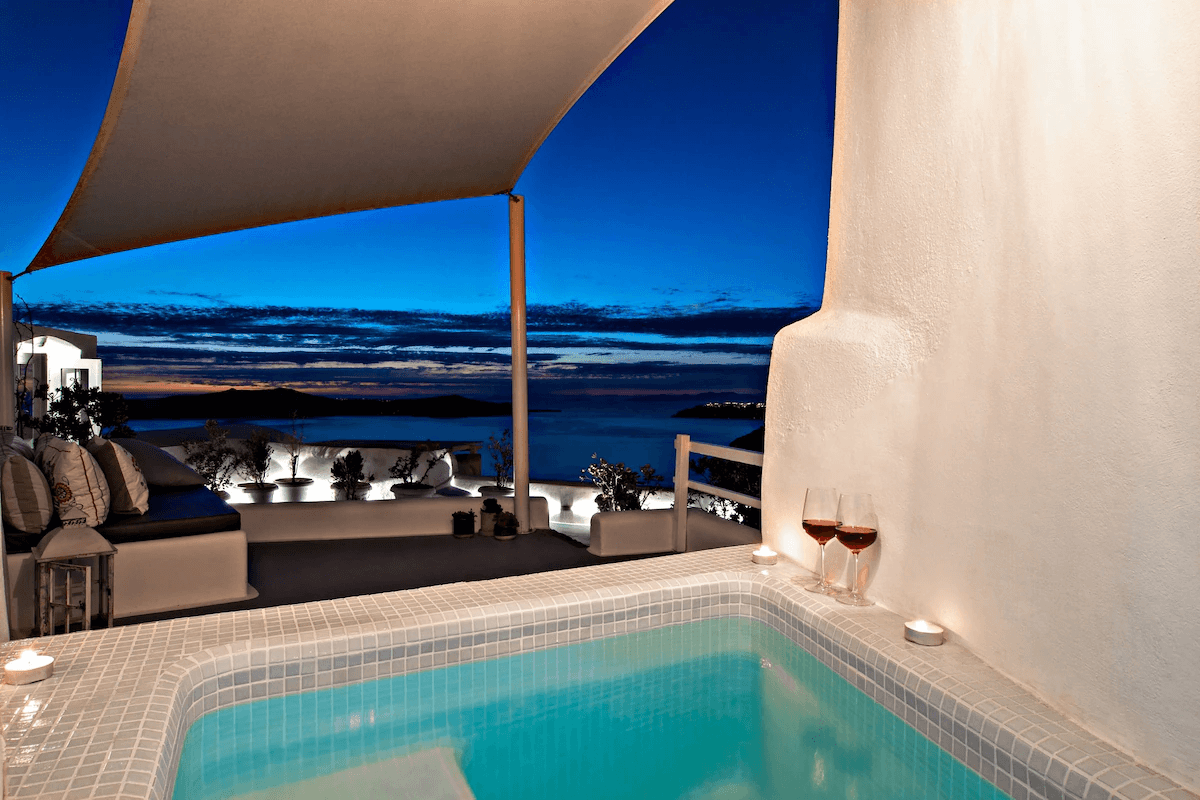 heated pool with evening caldera views at Cave Villa in Fira, Santorini
