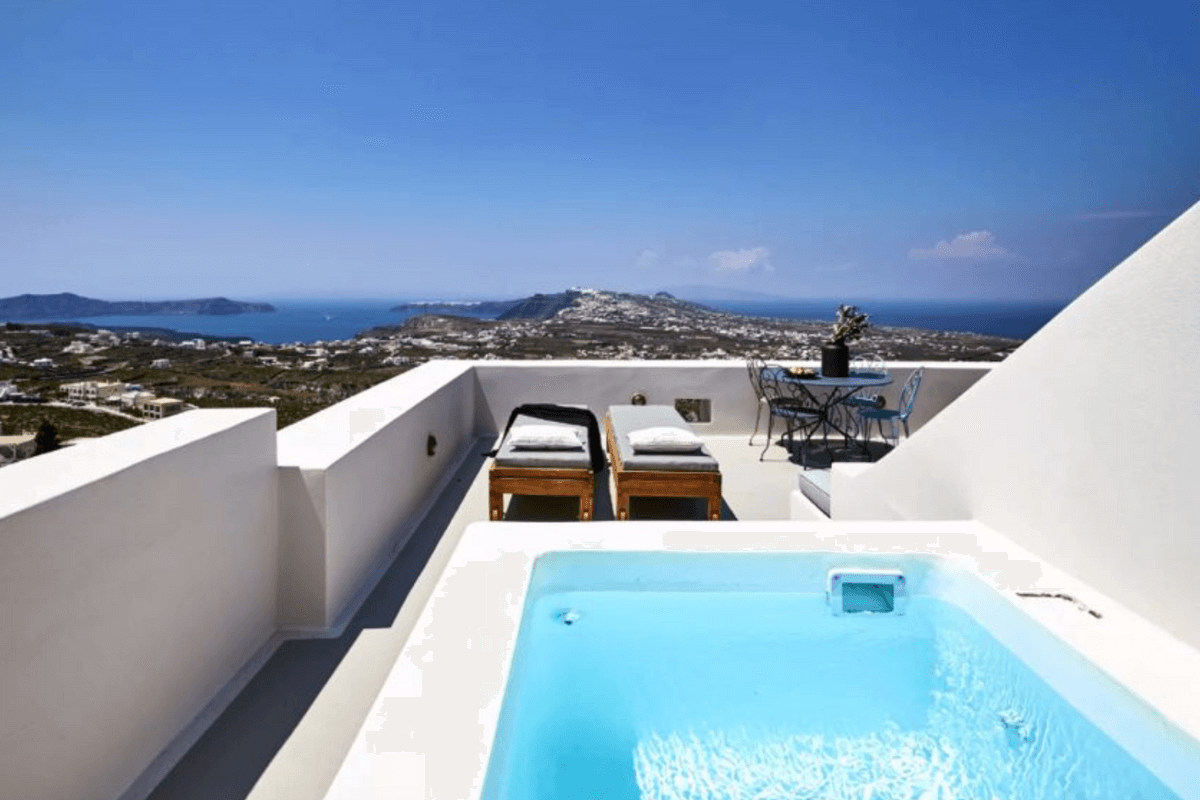 Romantic private pool at White & Co. La Torre Suites in Santorini, offering breathtaking Aegean Sea views under a blue sky.