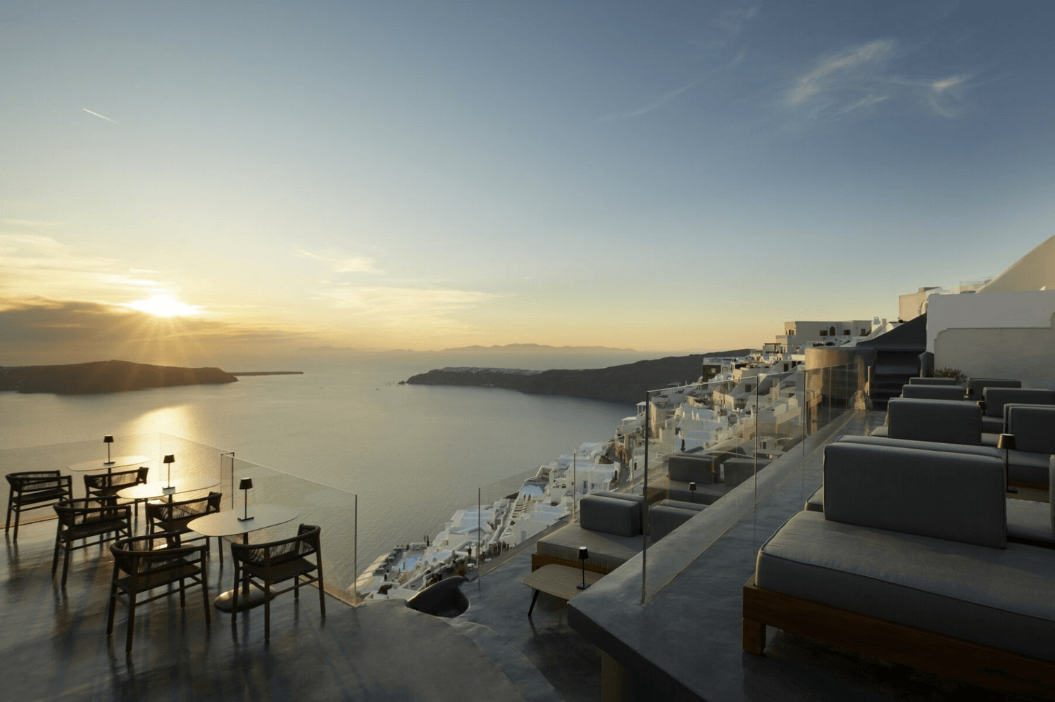Stunning sunset view from the terrace at Kivotos Hotels & Villas, Imerovigli Santorini, overlooking the caldera and Aegean Sea.