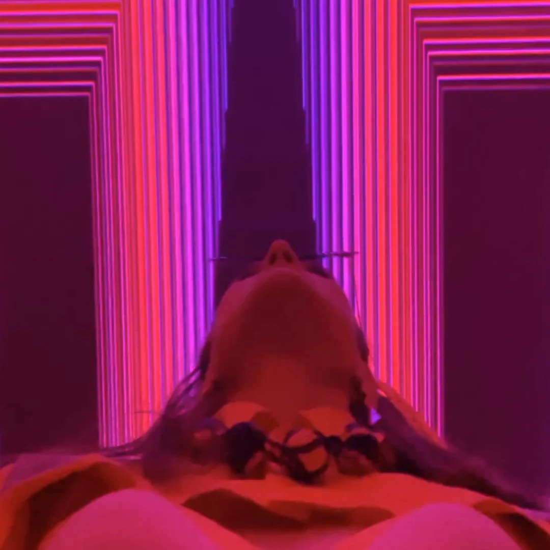 A woman looking at the laser effect during a dj night at Ivy Sydney