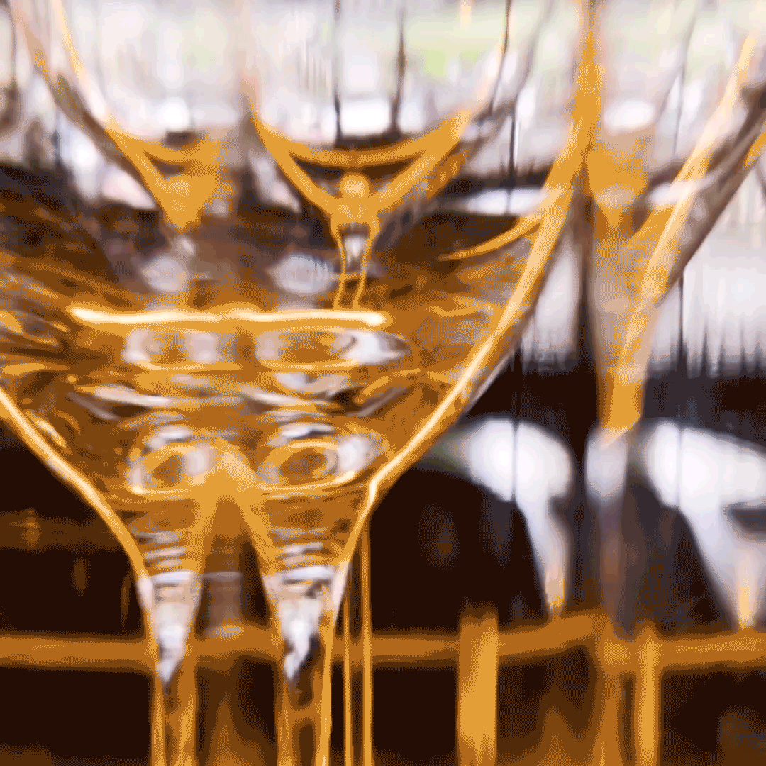 Close up of wine glasses view through rippled glass 