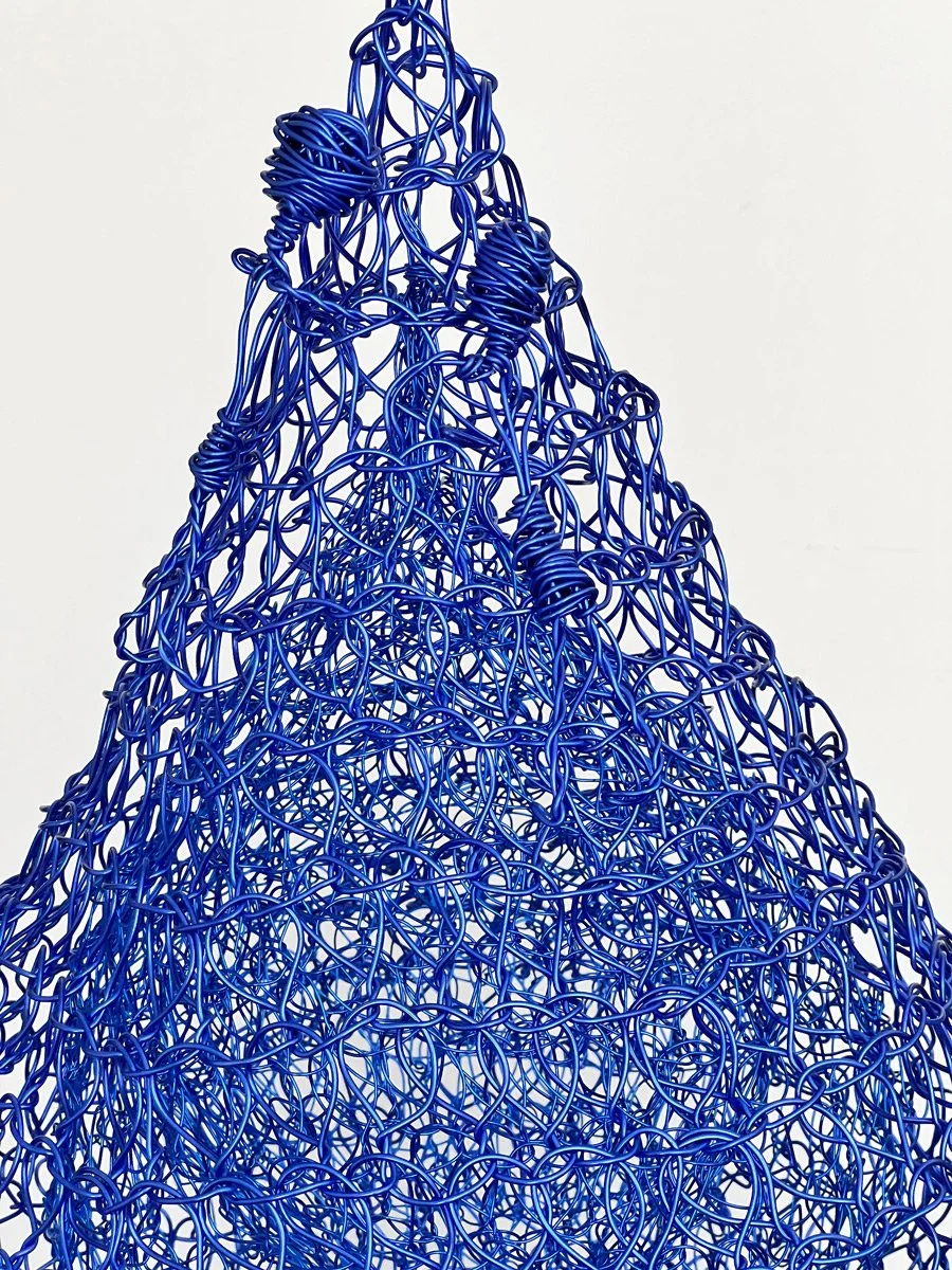 HOLD ON

This sculpture as part of the Tear Series has two
figures hanging on. As I made the sculpture the 
music worm of “hang on, help is on the way” 
constantly repeated in my brain. 