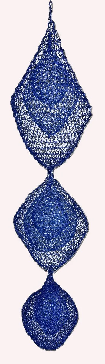 RIVER OF TEARS

The wire sculptures are an exploration of form in space, containment within containment and, with an acknowledgement to Brancusi’s Endless Column, the possibility of the continuation of a form into infinity.

This sculpture with its s