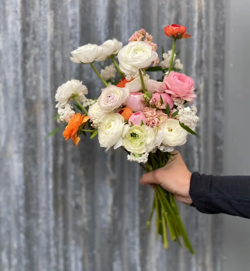 A decidedly citrus-y vibe with this one. 

It's a wet, soaking, warm spring day here that will send the last of the blossoms to the sodden ground and prompt the lifting of the ranunculus until next year.

Ranunculus, stock and Spiraea (maybush).