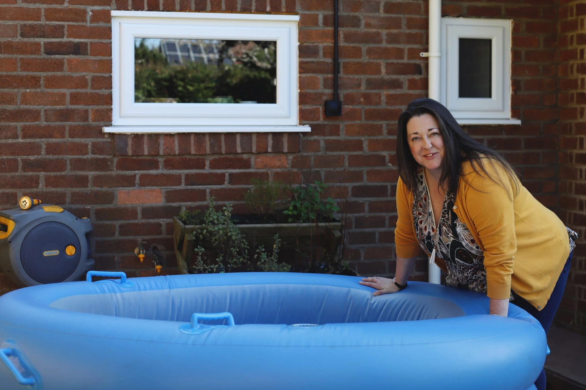 The Hypnobirthing Doula preparing a birth pool for a Wirral based client having a water birth a home.