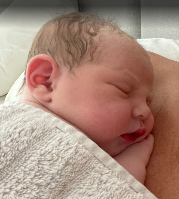 Peaceful newborn skin-to-skin moment after home birth with doula support in Cheshire