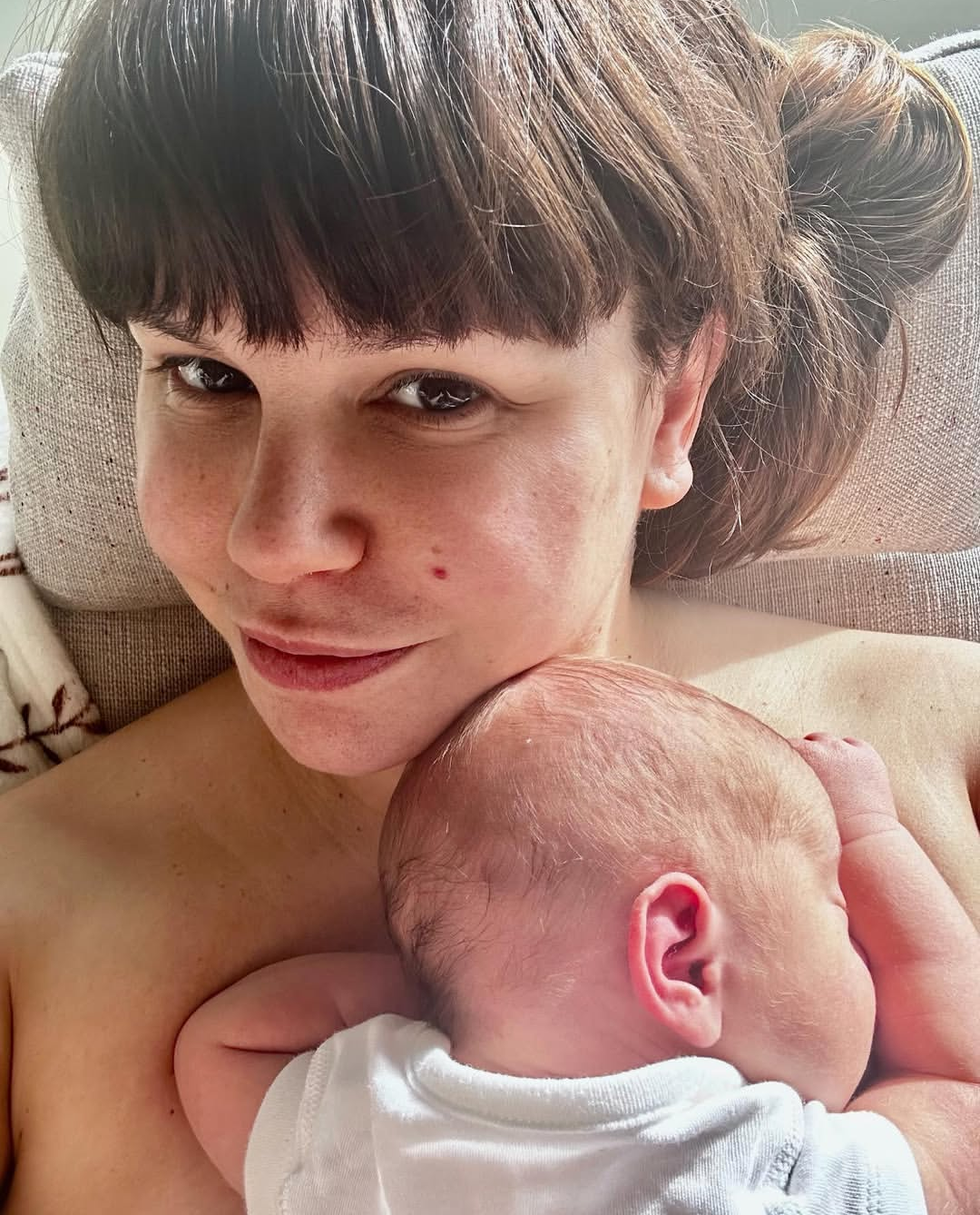 Jessica Fox, Hollyoaks actor, with newborn after birth doula support in Cheshire