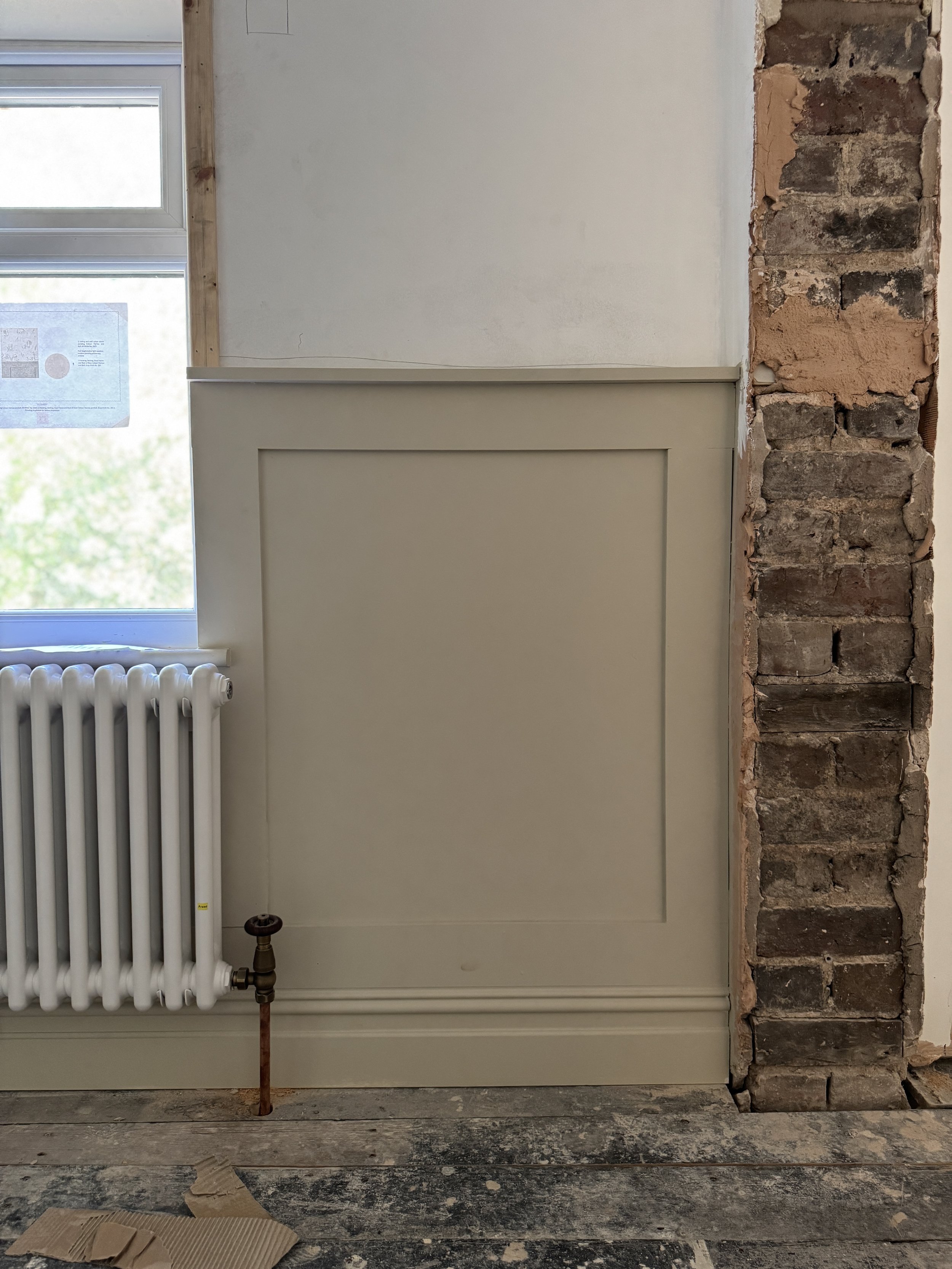 Traditional wall panelling introducing proportion, texture and subtle architectural interest throughout the renovation.