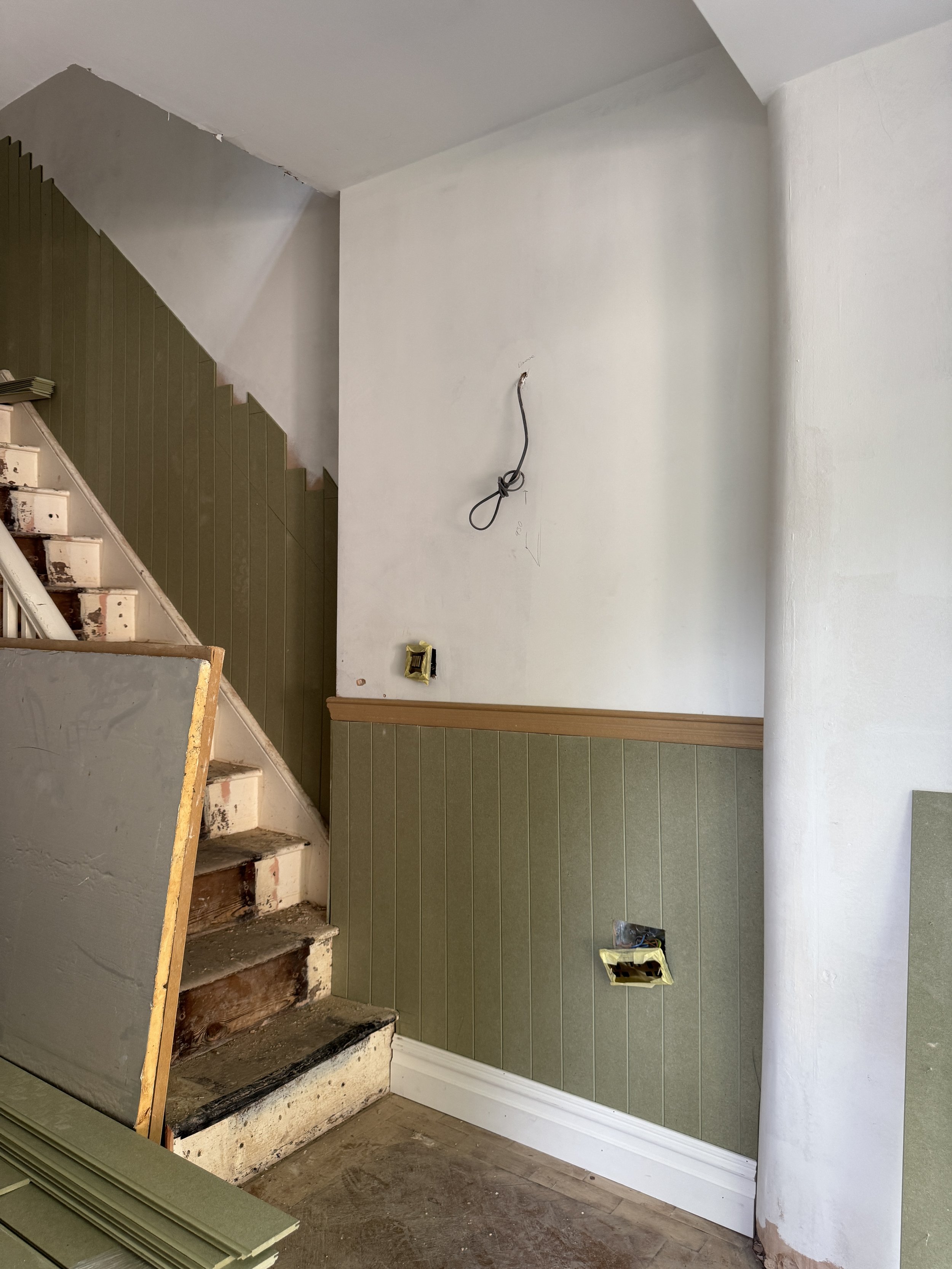 Panelling bringing warmth, texture and traditional detailing to the entrance hall.