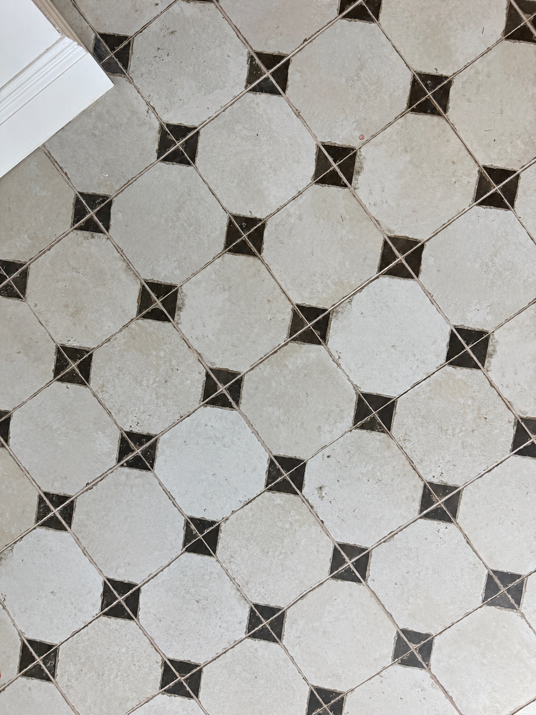 Traditional Victorian-style floor tiles introduce character and heritage-inspired detailing, complementing the bespoke joinery throughout Project Orton.