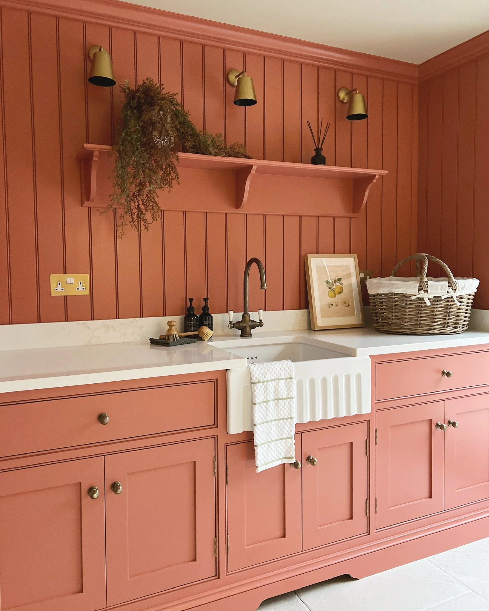 Colourful utility room designed by Istigh Interiors featuring bespoke cabinetry and playful use of colour in a family home renovation.