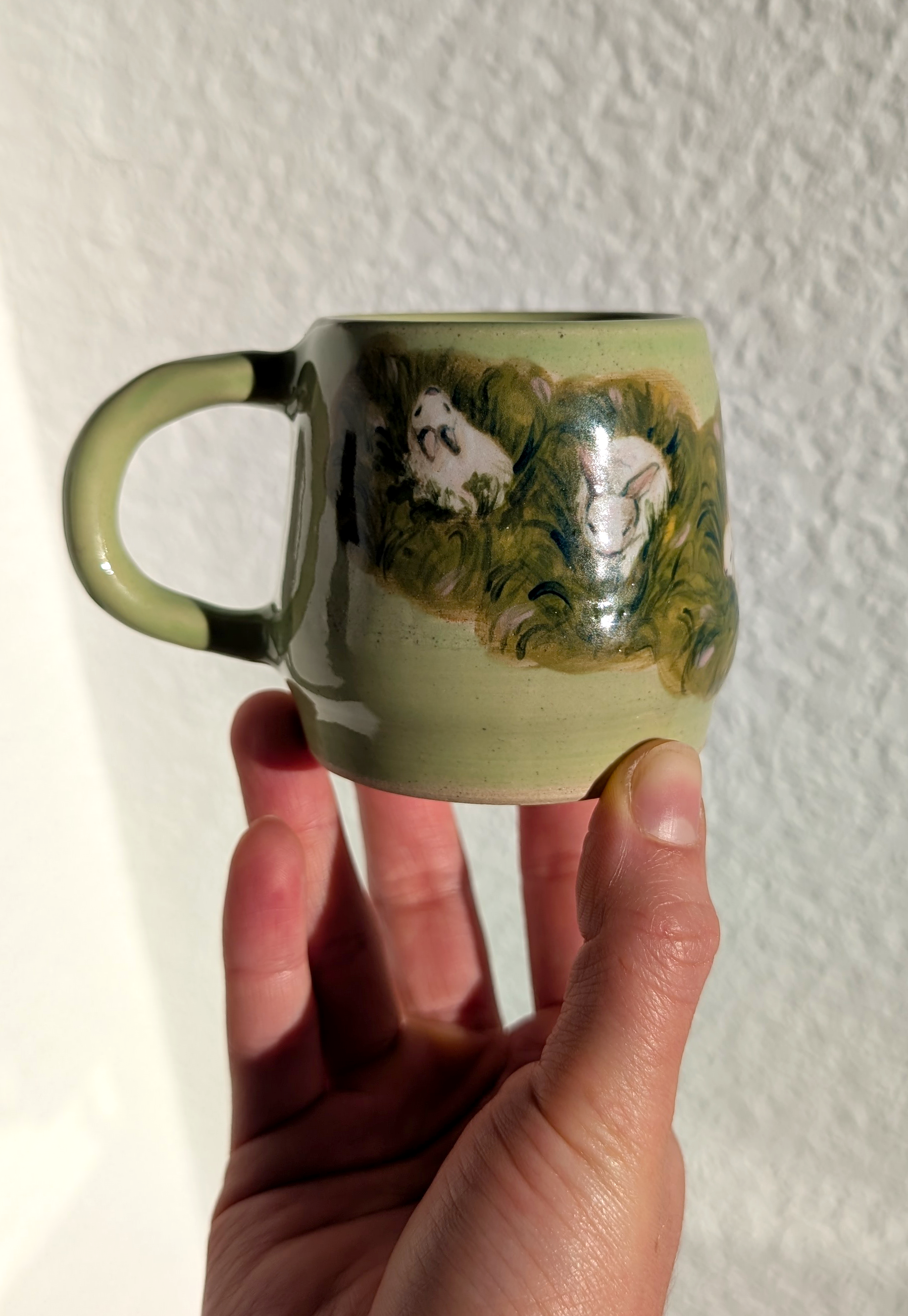 rabbits in the grass mug front edited.png