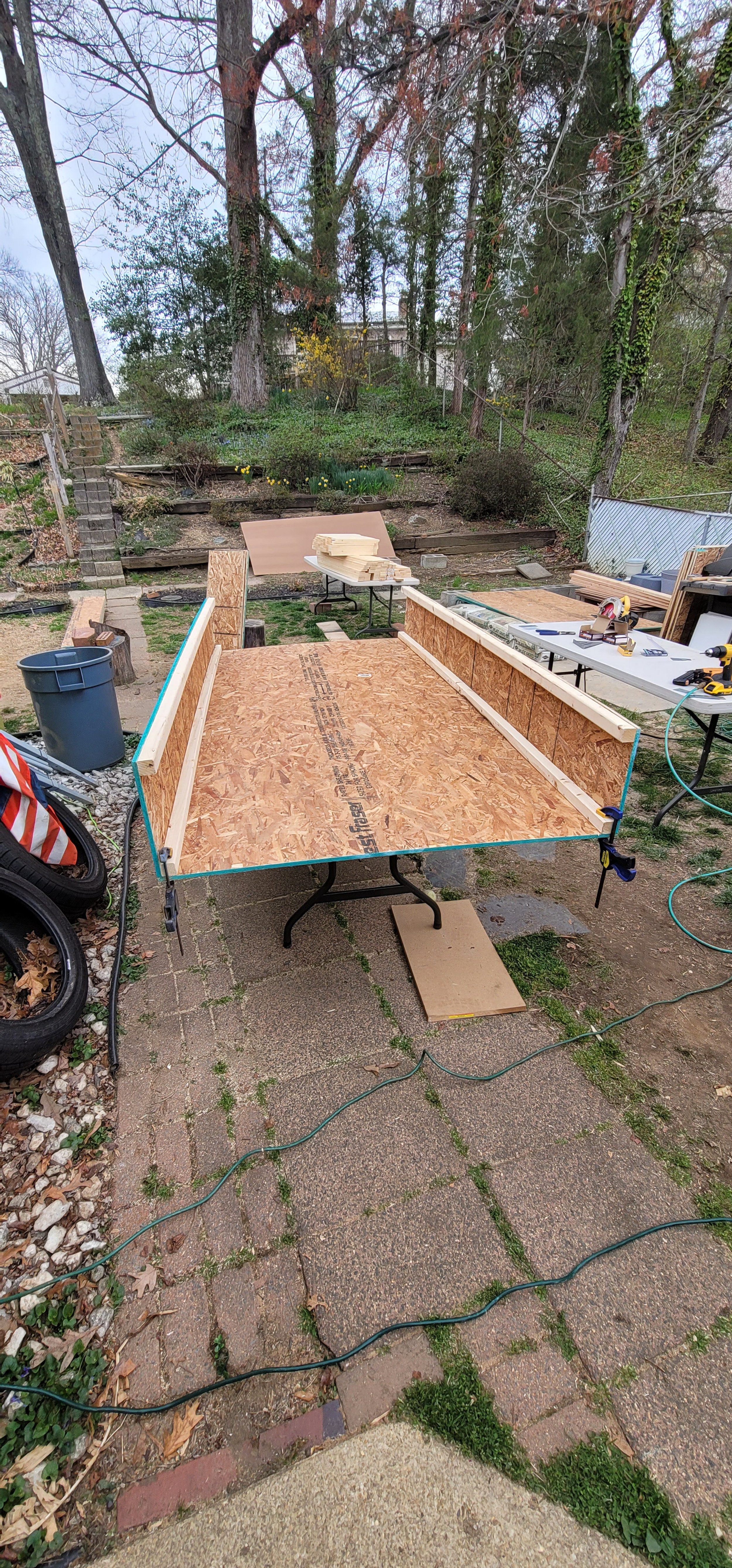 Early-stage fabrication of a custom faux boxwood hedge base by GhostSquad_Design, crafted for the Augusta After Dark event during Masters Week. This photo shows the framed structure being clamped for precise alignment before paneling, part of a modul