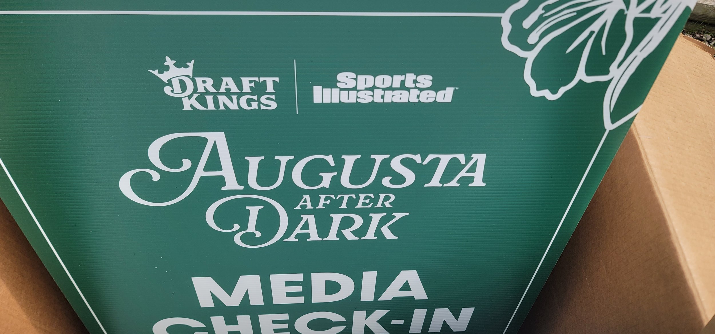 Custom event signage for Augusta After Dark, a premium Masters Week experience presented by DraftKings and Sports Illustrated. GhostSquad_Design provided custom faux boxwood hedge installations for this high-profile event, blending functional event d