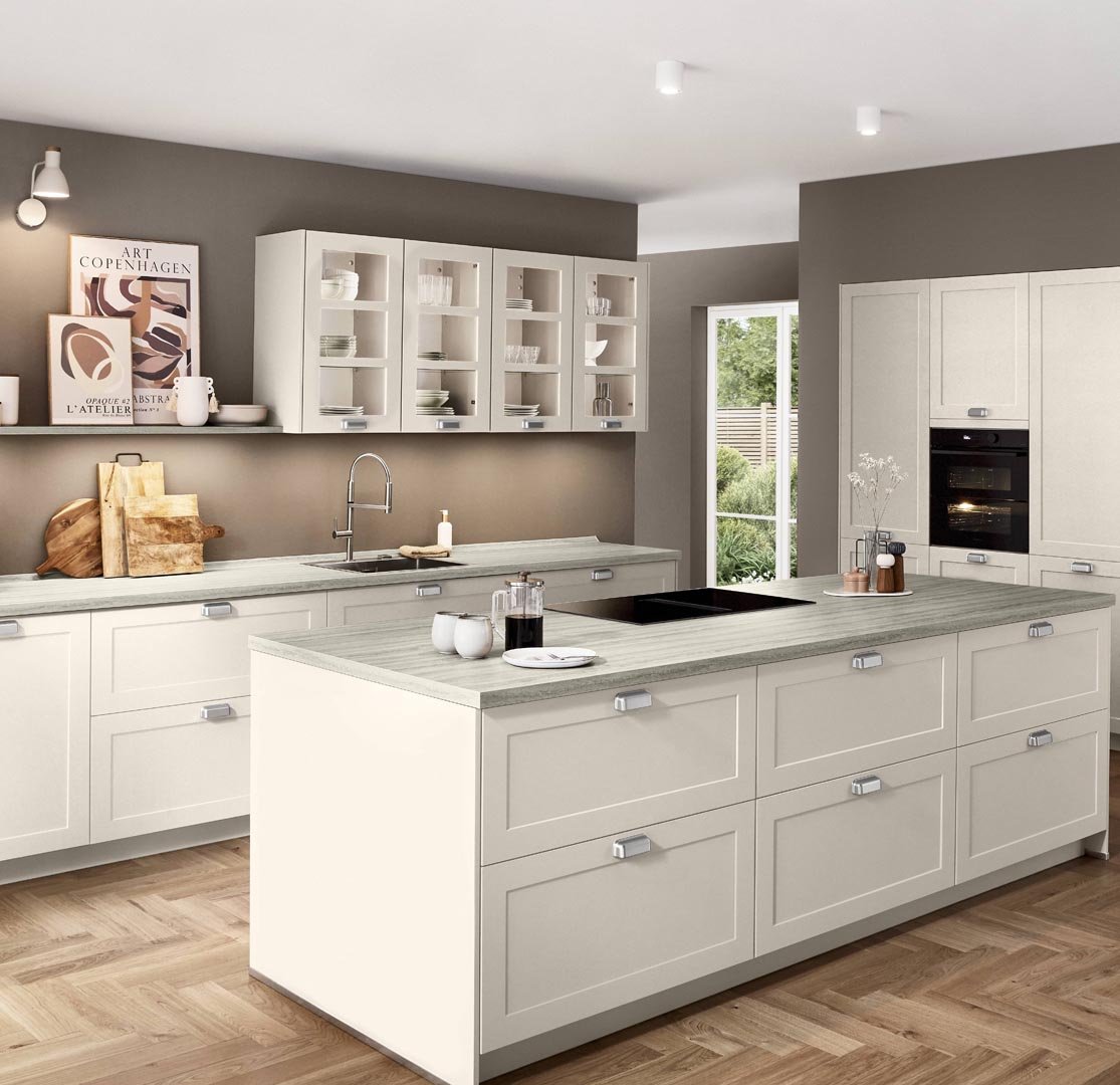 Modern kitchen with white cabinetry, a kitchen island with a light wood countertop, open shelves with dishes, and a window with a view of greenery.