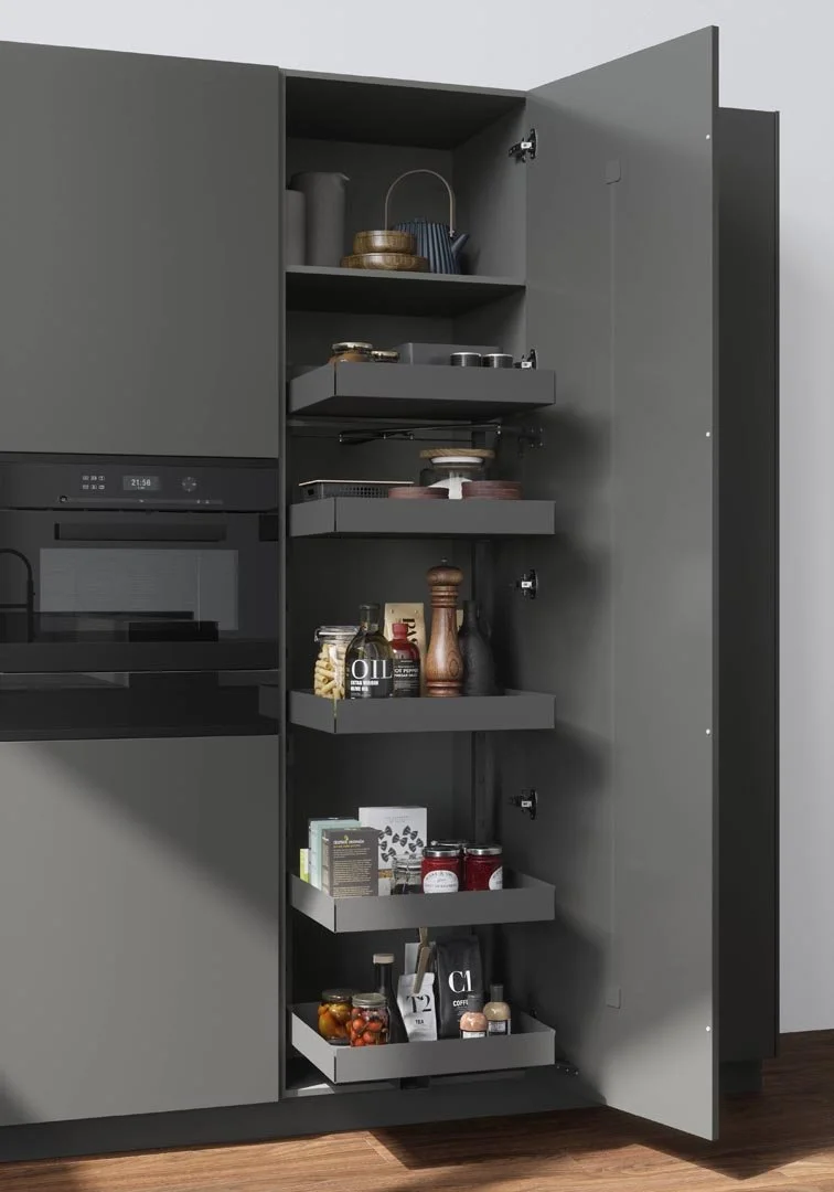 Open kitchen cabinet with spice jars, canned goods, and snacks on gray shelves