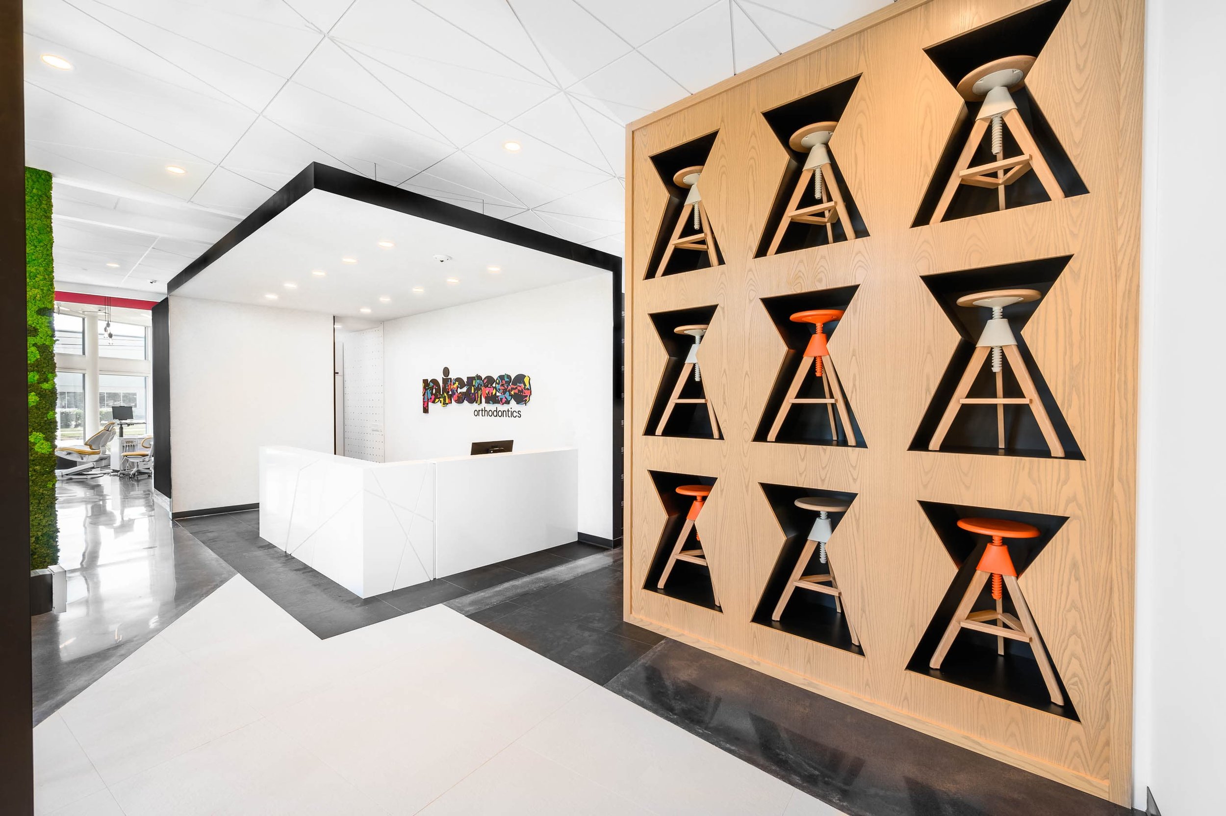 Reception area at Picasso Orthodontics showcasing vibrant design