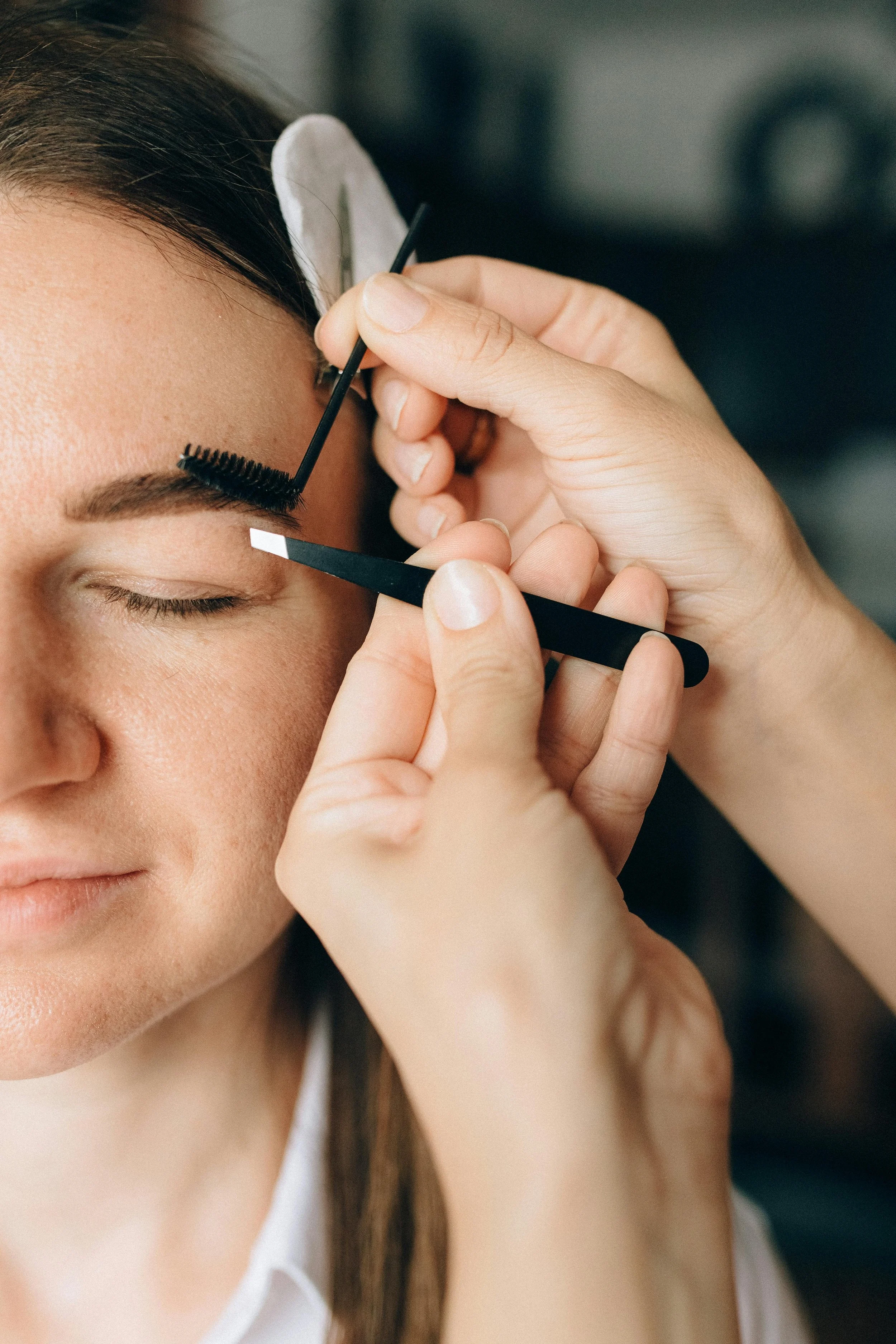 client getting eyebrow waxing raleigh nc