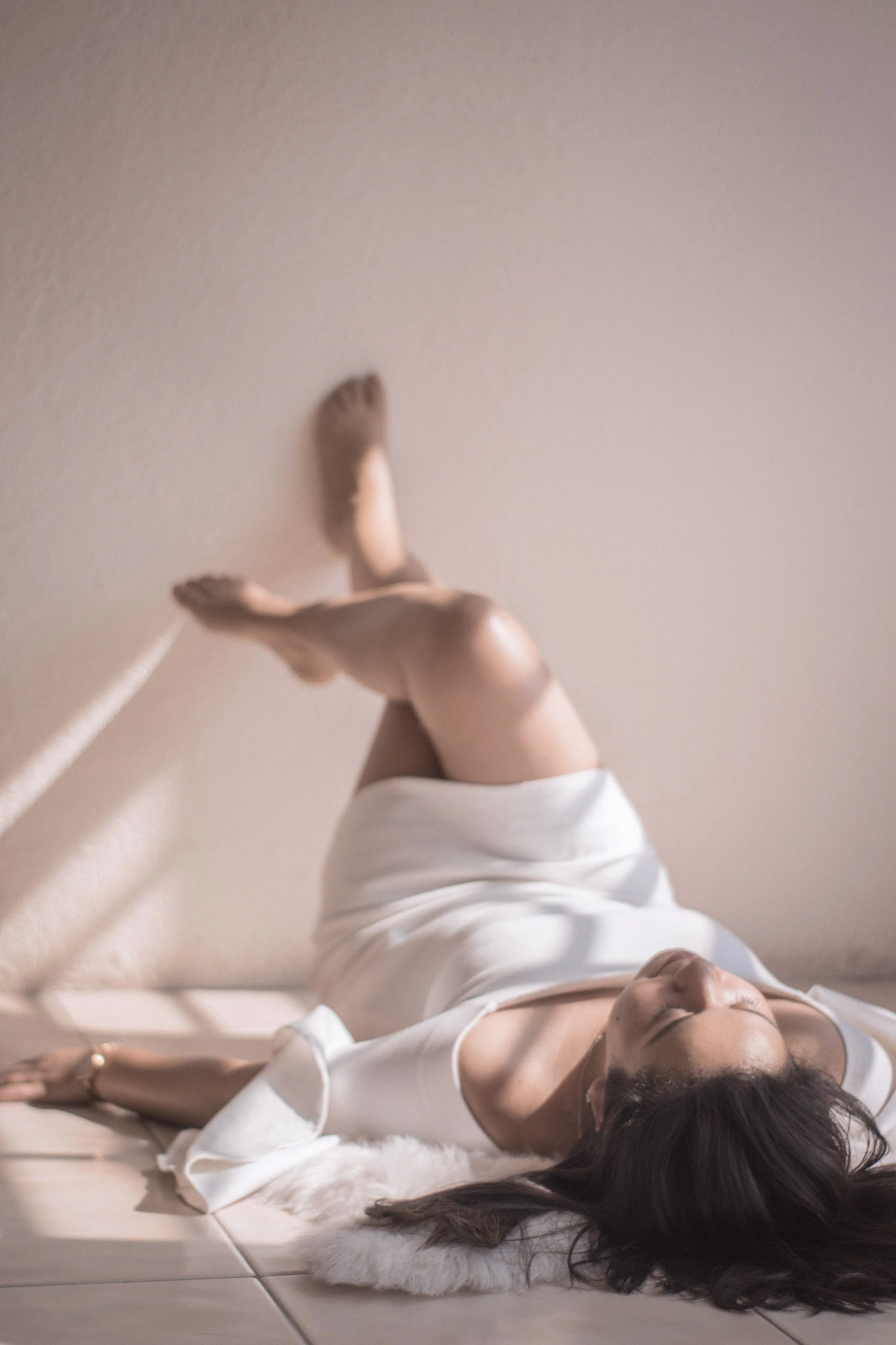 stock image of a woman lying down, body waxing raleigh nc