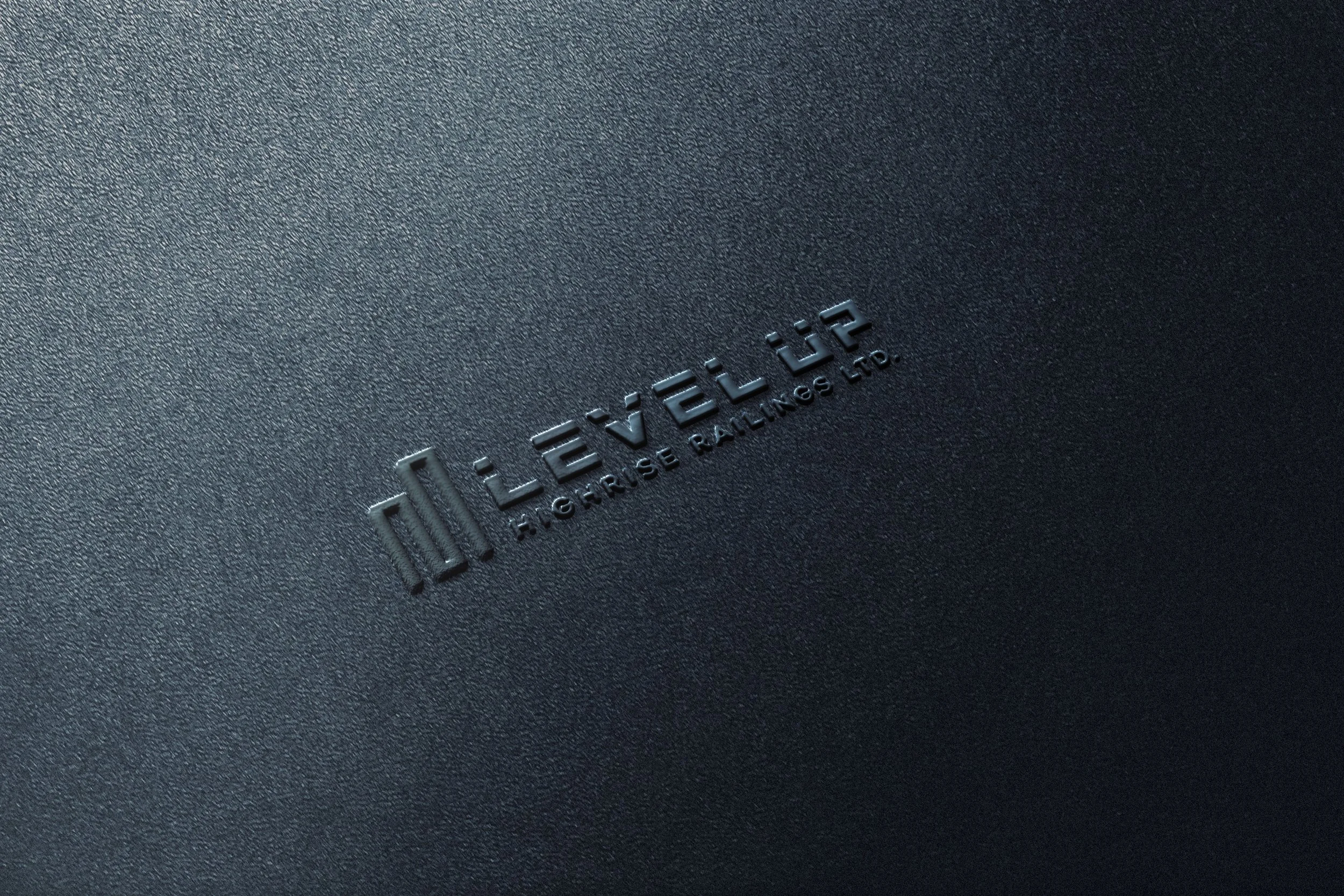 Close-up of the textured surface of a black or dark gray electronic device with the embossed logo 'Hori Hori' and the text 'Horie Railing Ltd.'