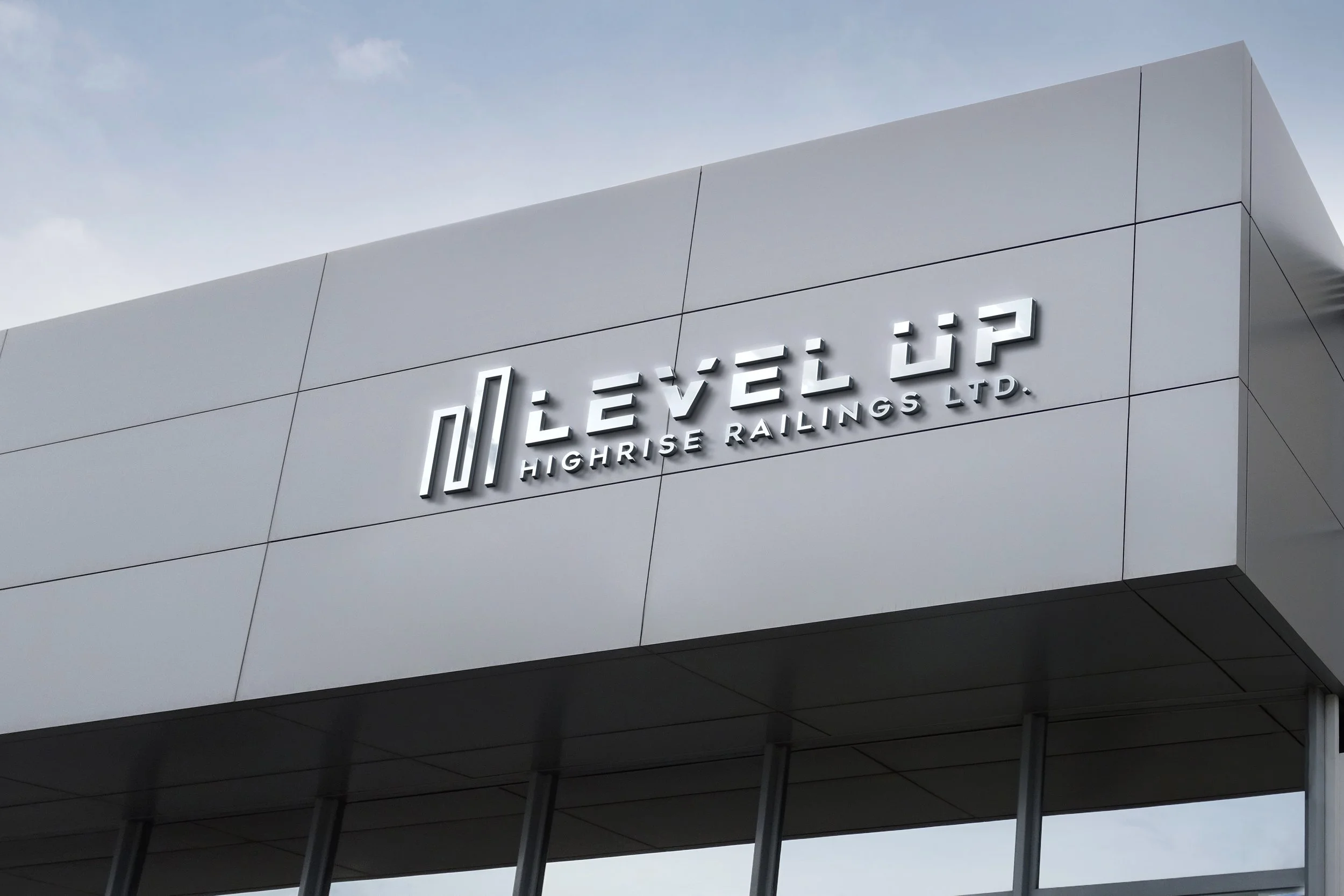 Modern building exterior with a sign reading 'LEVEL UP HIGHRISE RAILINGS LTD.'