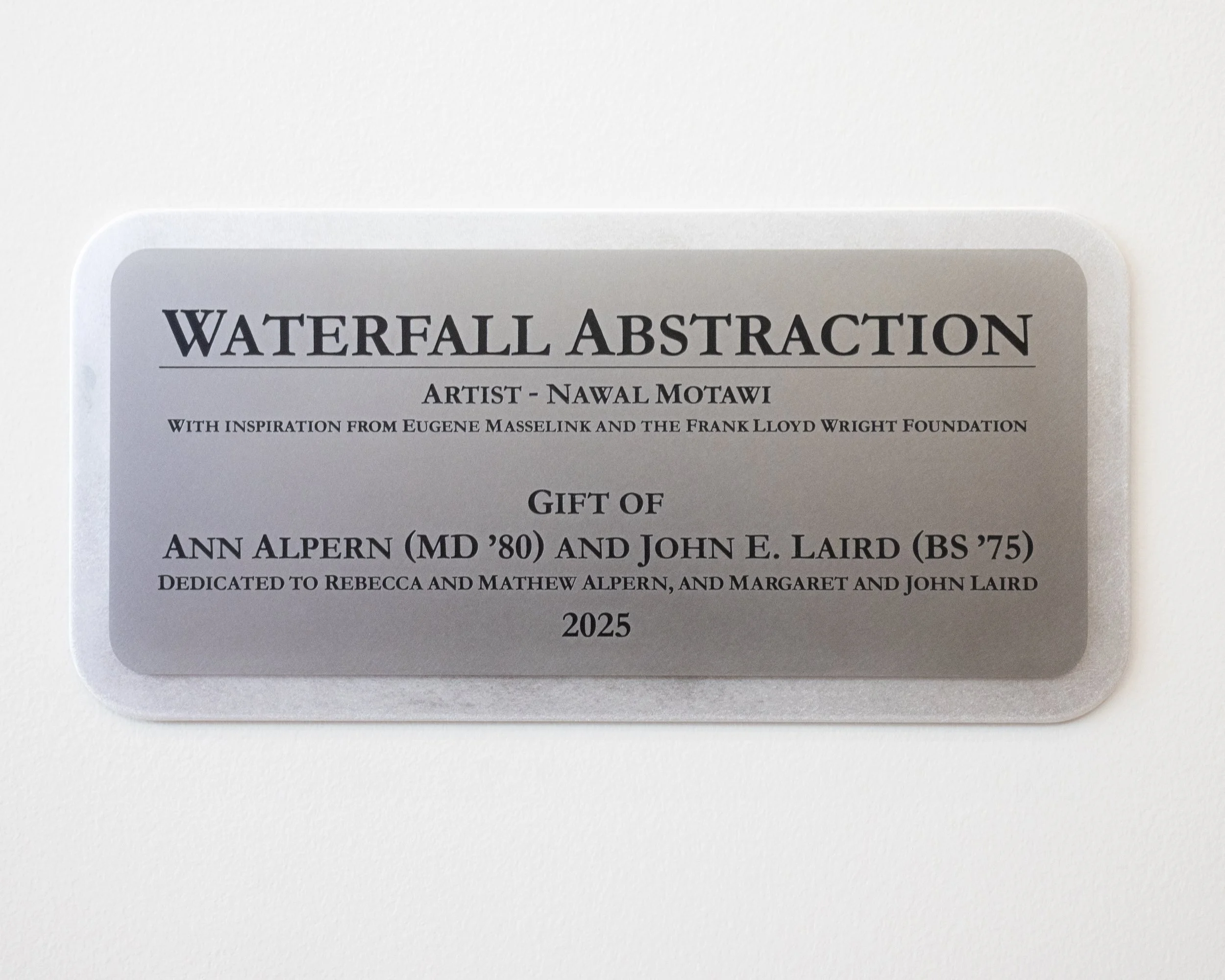 Official plaque as seen under the mural in the Leinweber Building