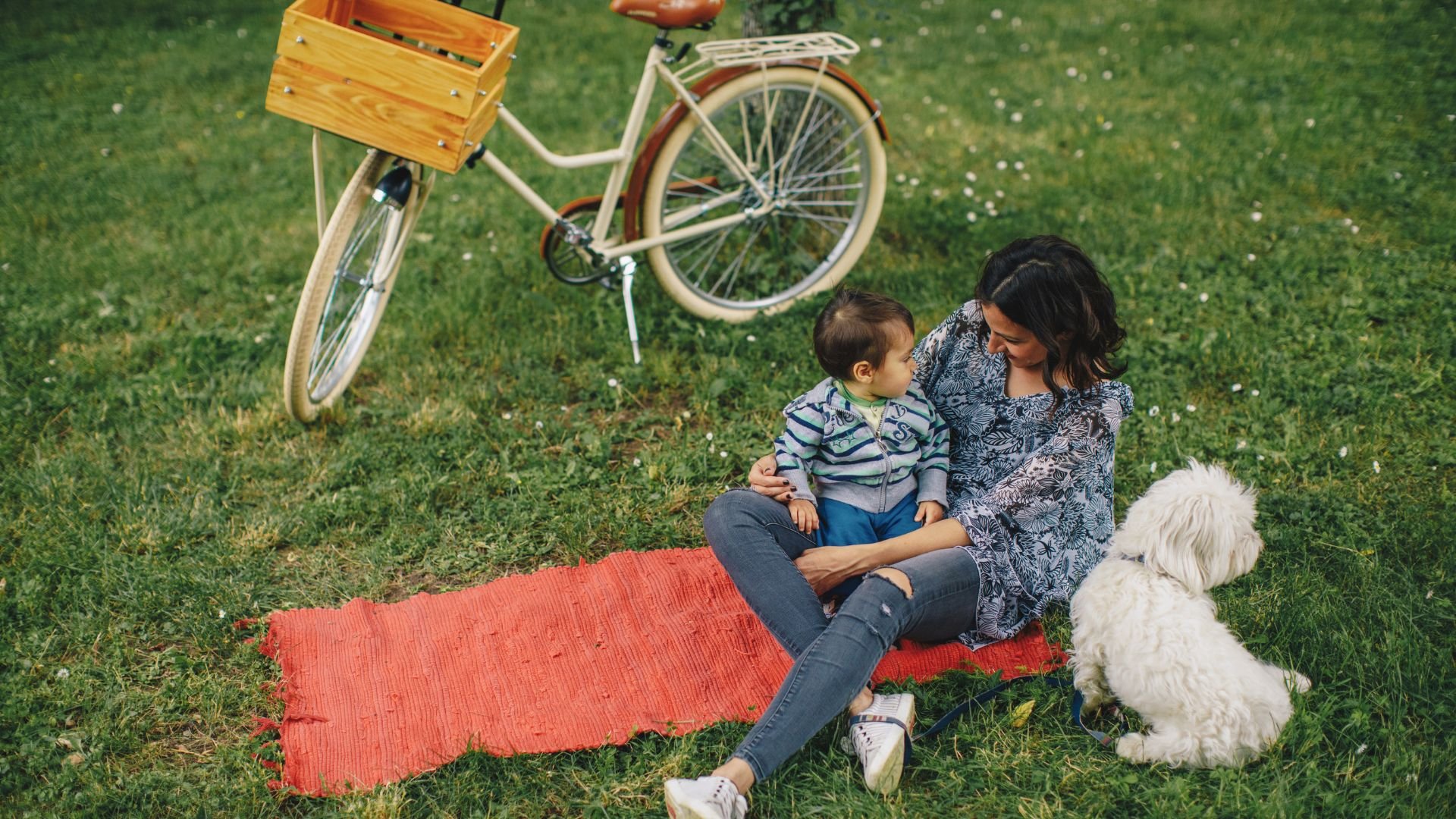 Professional summer nanny engaging children in outdoor summer activities
