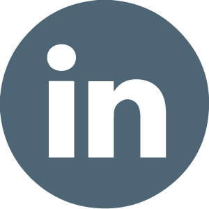 LinkedIn logo in a dark gray circle.