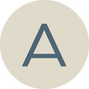 Letter 'A' displayed on a round beige background.