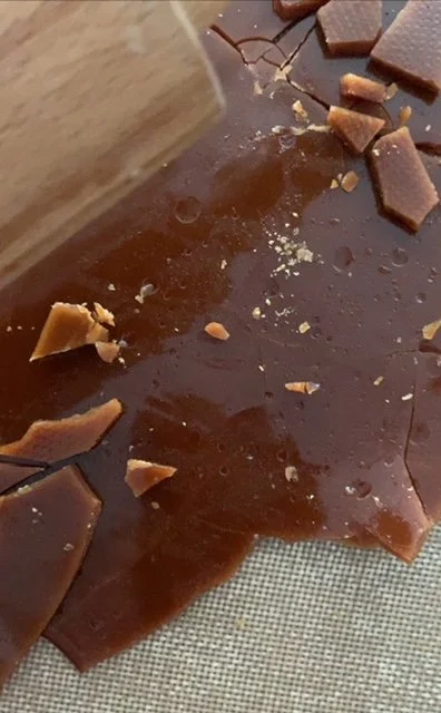 Toffee being broken into bits