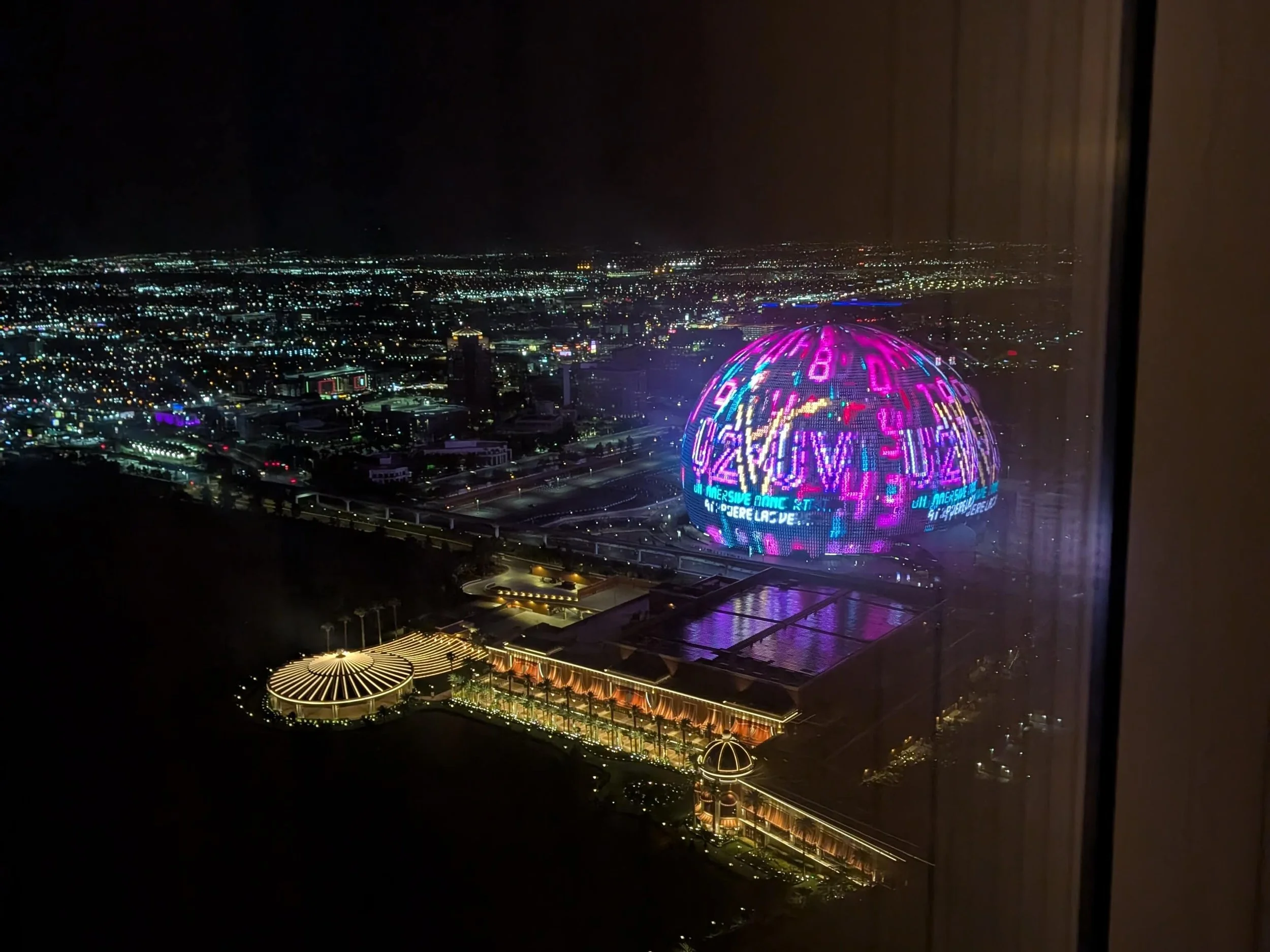 Sphere entertainment venue in Las Vegas displaying colorful graphics on its exterior LED screen