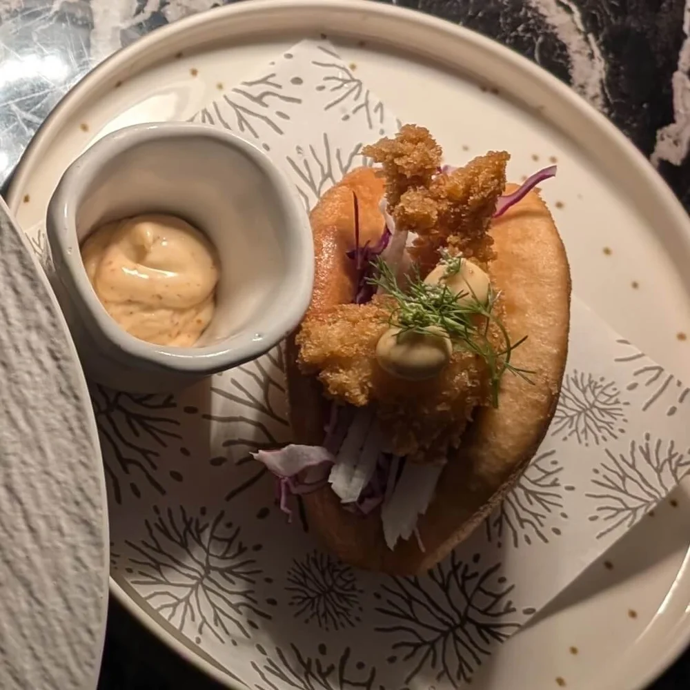 Crispy Bao – Tempura shrimp crispy bao with pickled ginger and ají panca mayo — a must-order appetizer at Seaside.