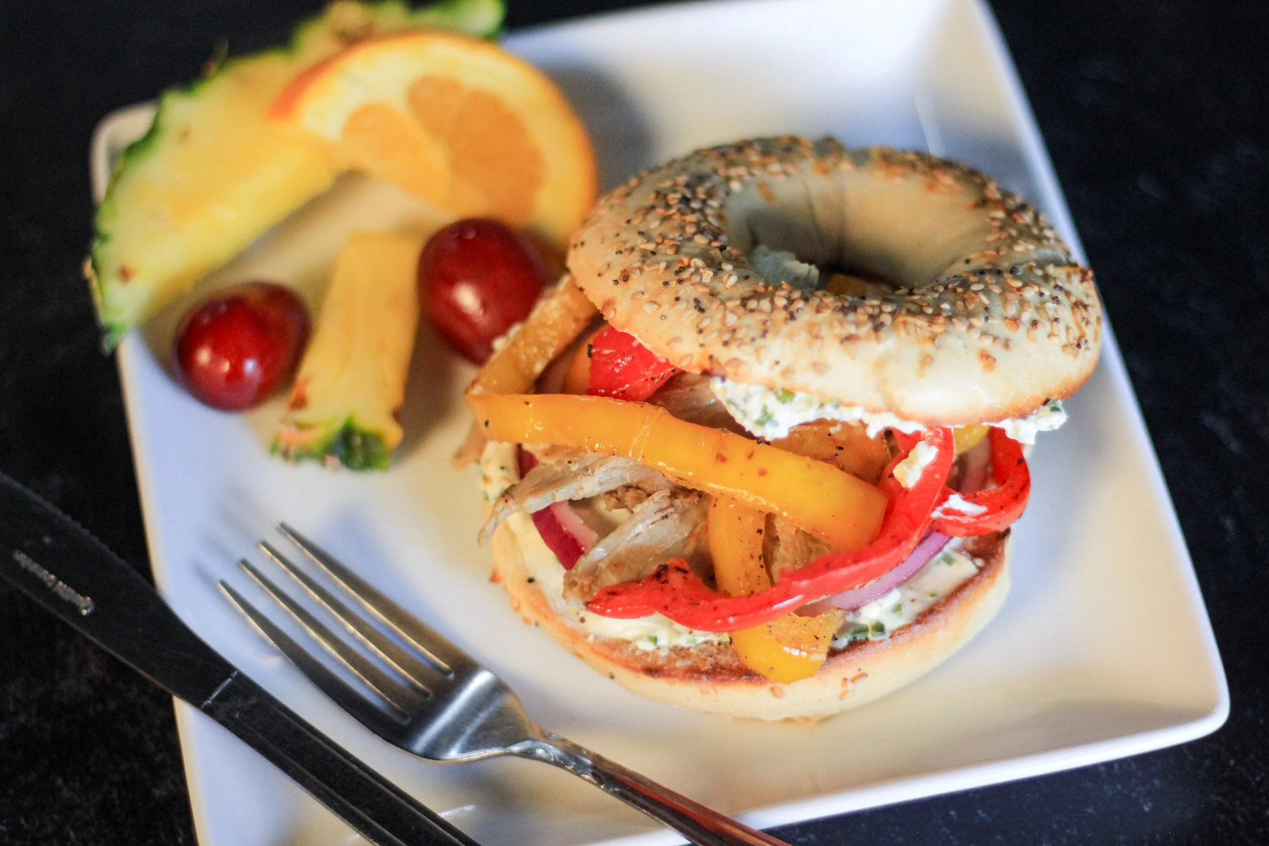 Special food at coastal coffee roasters featuring a spicy pork bagel in summerville South Carolina